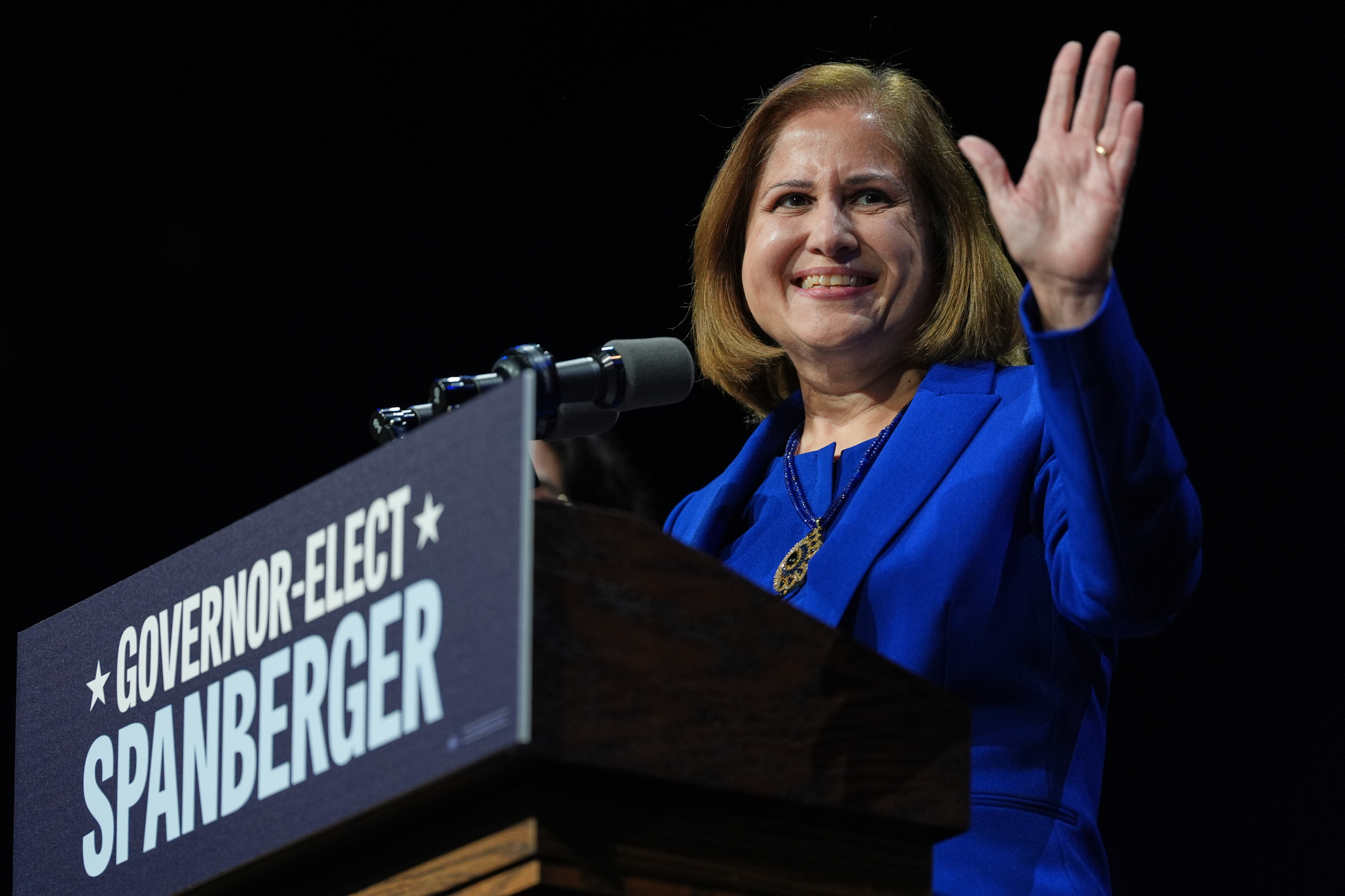 Democrat Ghazala Hashmi speaks on stage at an election night watch party