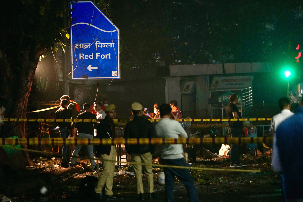 Security officers inspect the site of a car explosion near the historic Red Fort in Delhi, India, on November 10, 2025