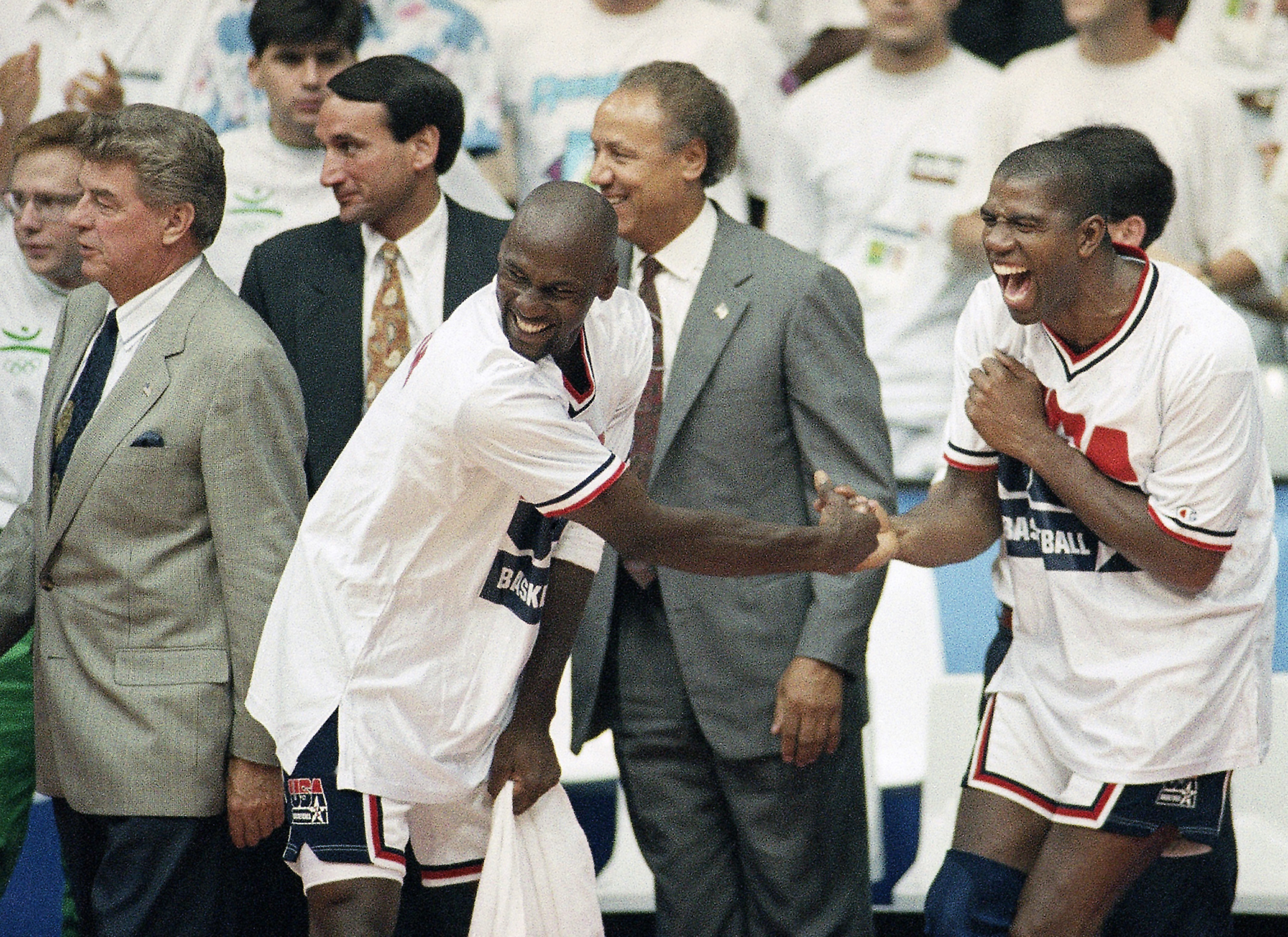 Lenny Wilkins, Michael Jordan and Earvin Johnson react.
