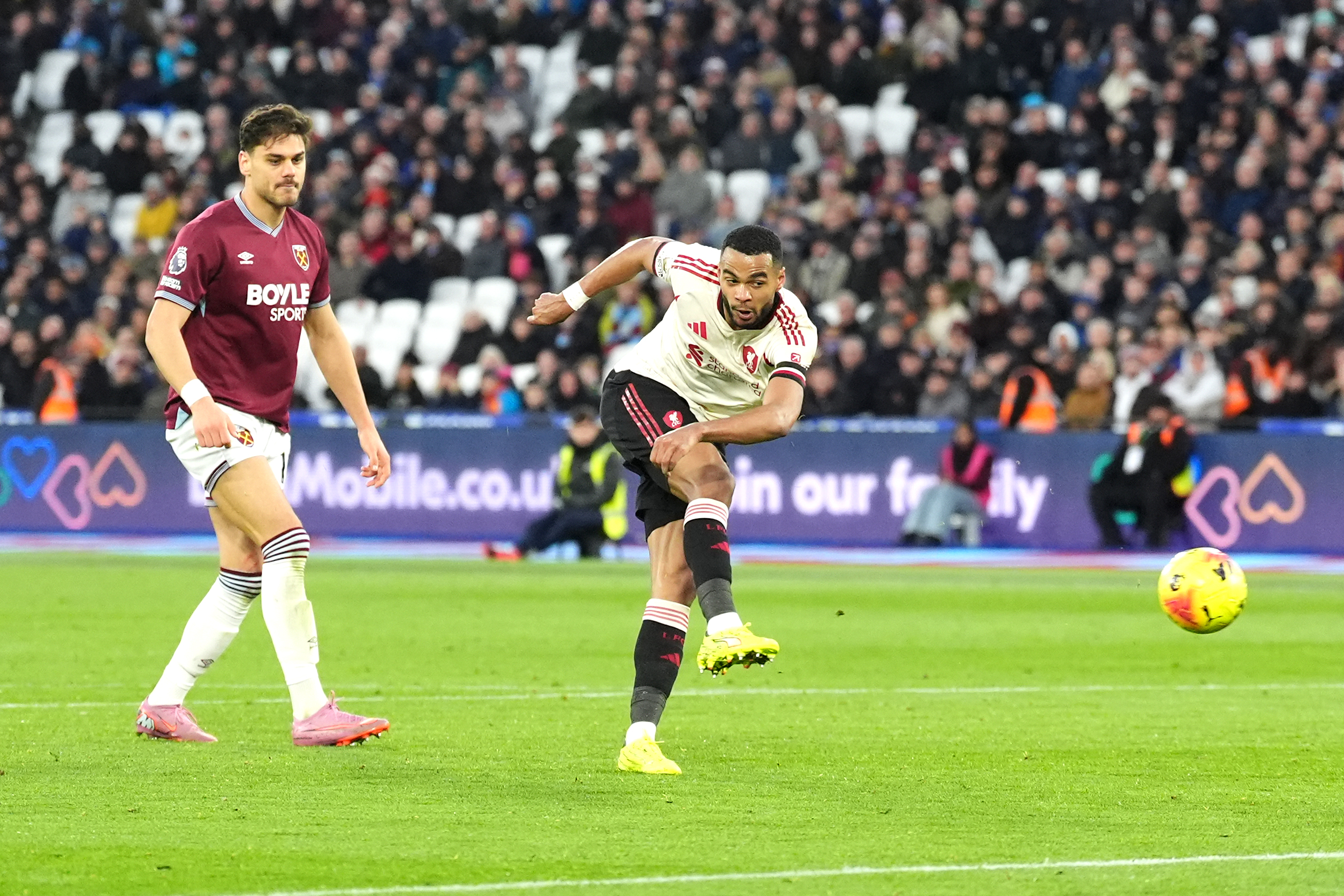 Cody Gakpo, right, scores Liverpool’s second goal against West Ham