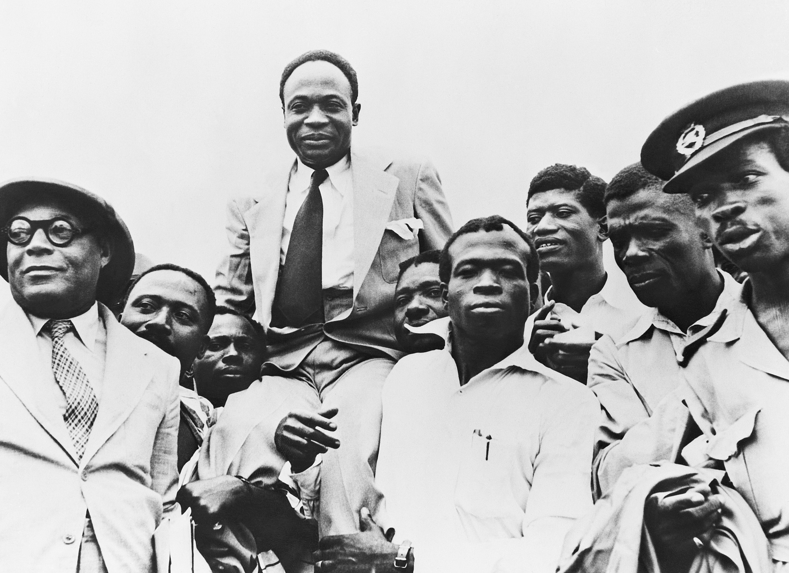 Government officials carry Prime Minister Kwame Nkrumah on their shoulders after Ghana obtained its independence from Great Britain