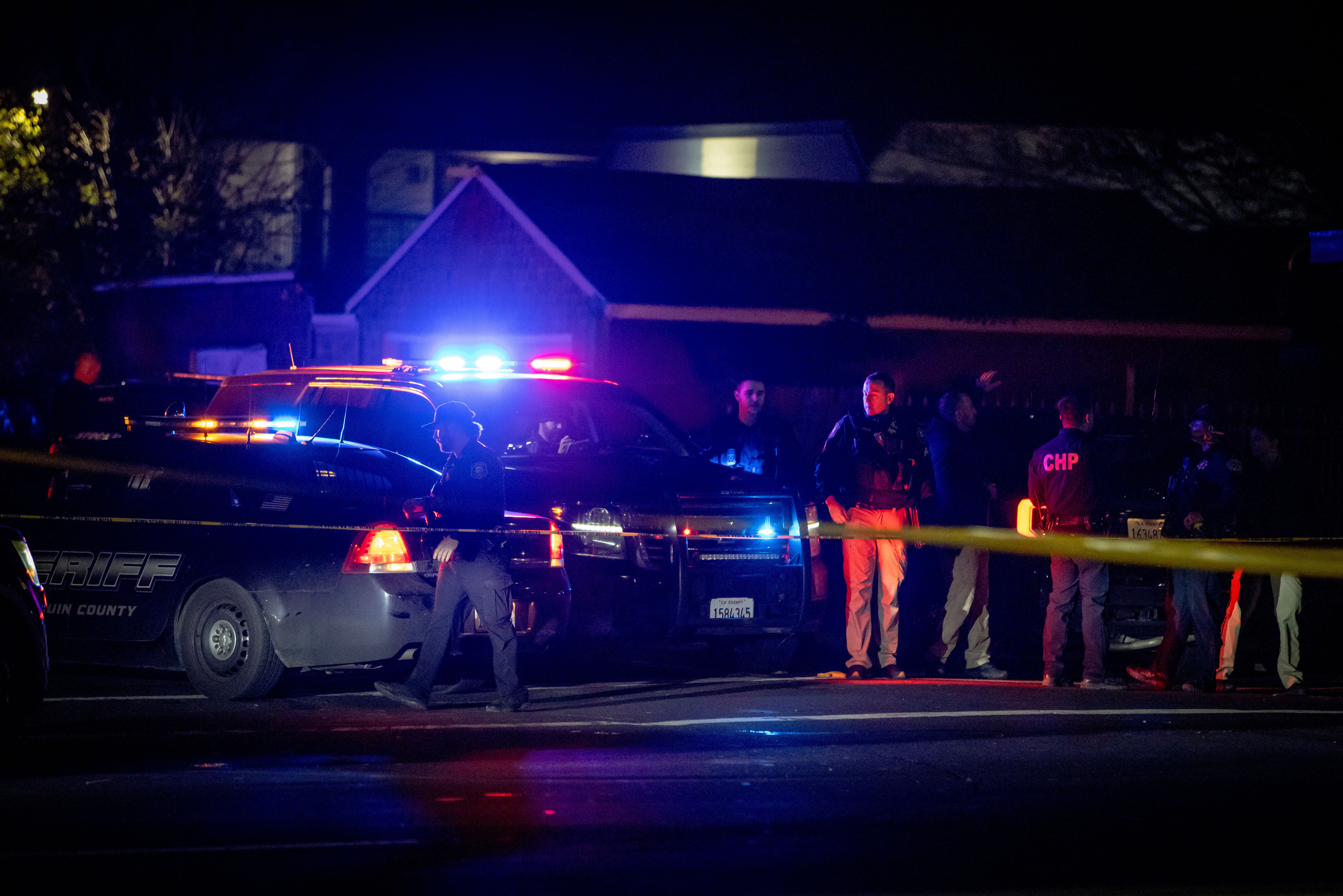 Emergency personnel work at the scene of a mass shooting.