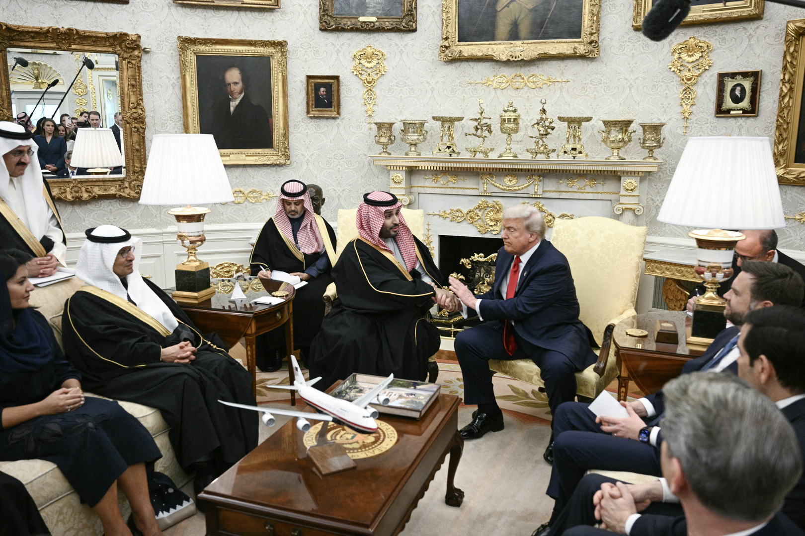 US President Donald Trump shakes hands with Crown Prince and Prime Minister of the Kingdom of Saudi Arabia Mohammed bin Salman in the Oval Office of the White House in Washington, DC on Nov. 18, 2025. Saudi Crown Prince Mohammed bin Salman arrived at the White House to fanfare and a jet flyover Tuesday, in his first visit to the United States since the 2018 murder of journalist Jamal Khashoggi. [Brendan Smialowski/AFP]
