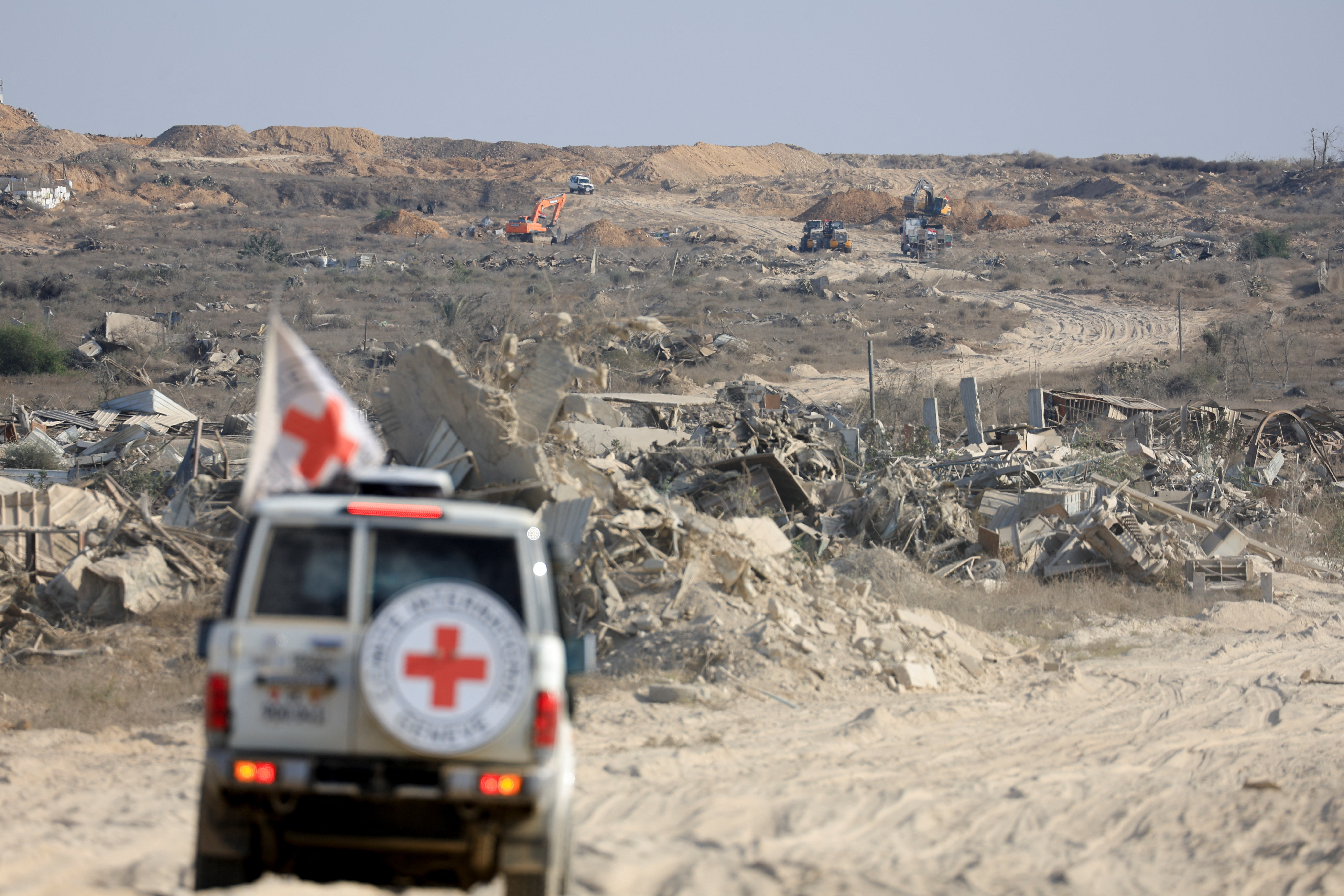 A Red Cross vehicle operates in an area within the so-called "yellow line" to which Israeli troops withdrew under the ceasefire. [File: Dawoud Abu Alk/Reuters]