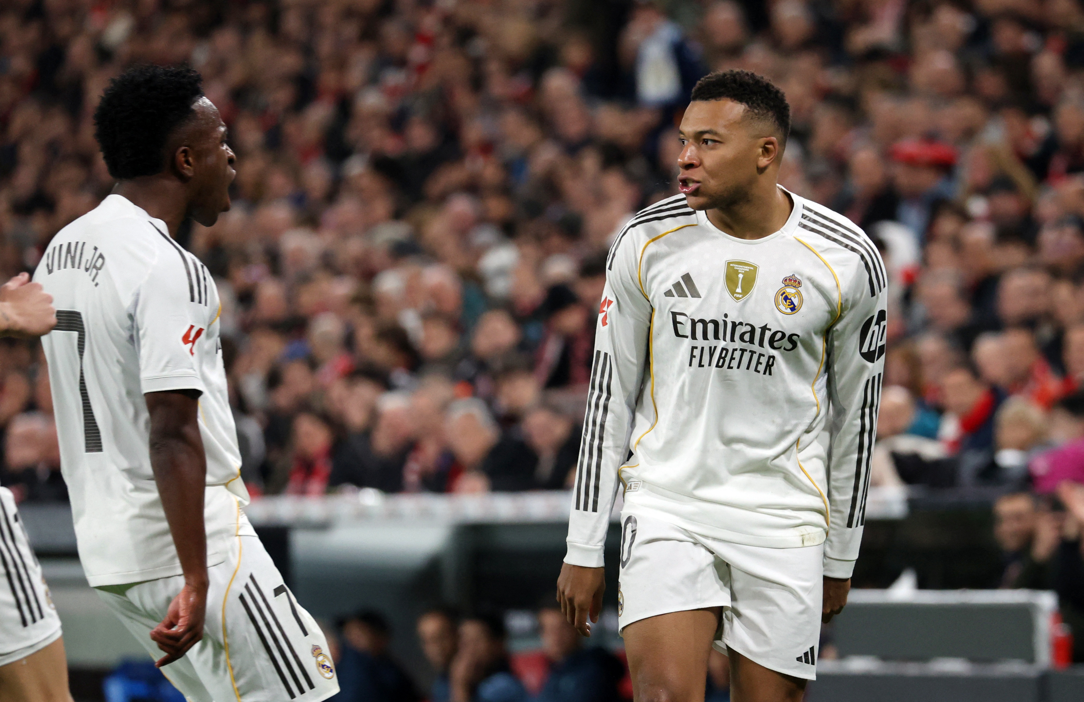 Real Madrid's Kylian Mbappe celebrates scoring their first goal with Vinicius Junior