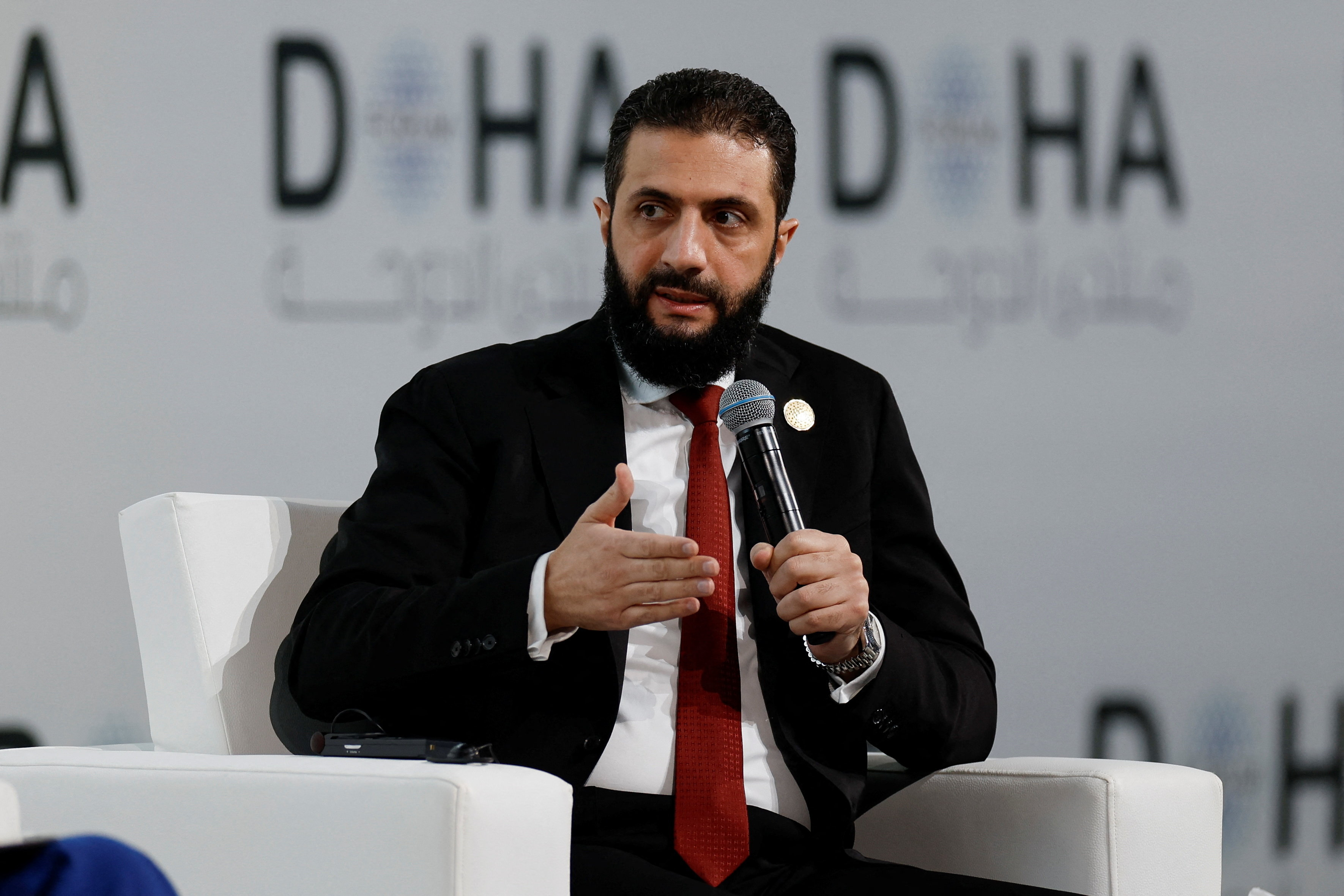 Syrian President Ahmed al-Sharaa speaks as he attends the 23rd edition of the annual Doha Forum, in Doha, Qatar, December 6, 2025