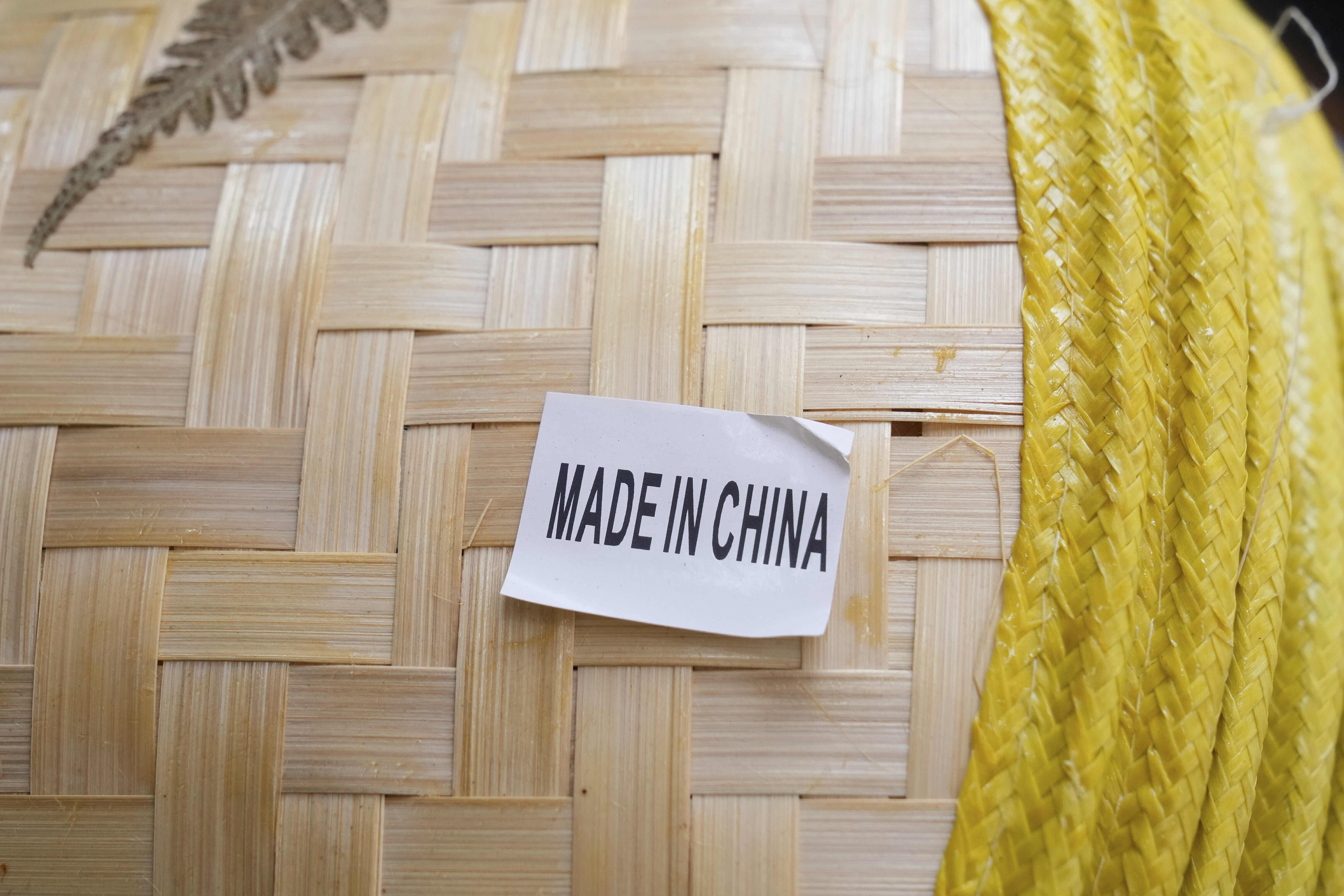 A made in China sticker is displayed on a hat at a store in Chinatown in San Francisco, USA
