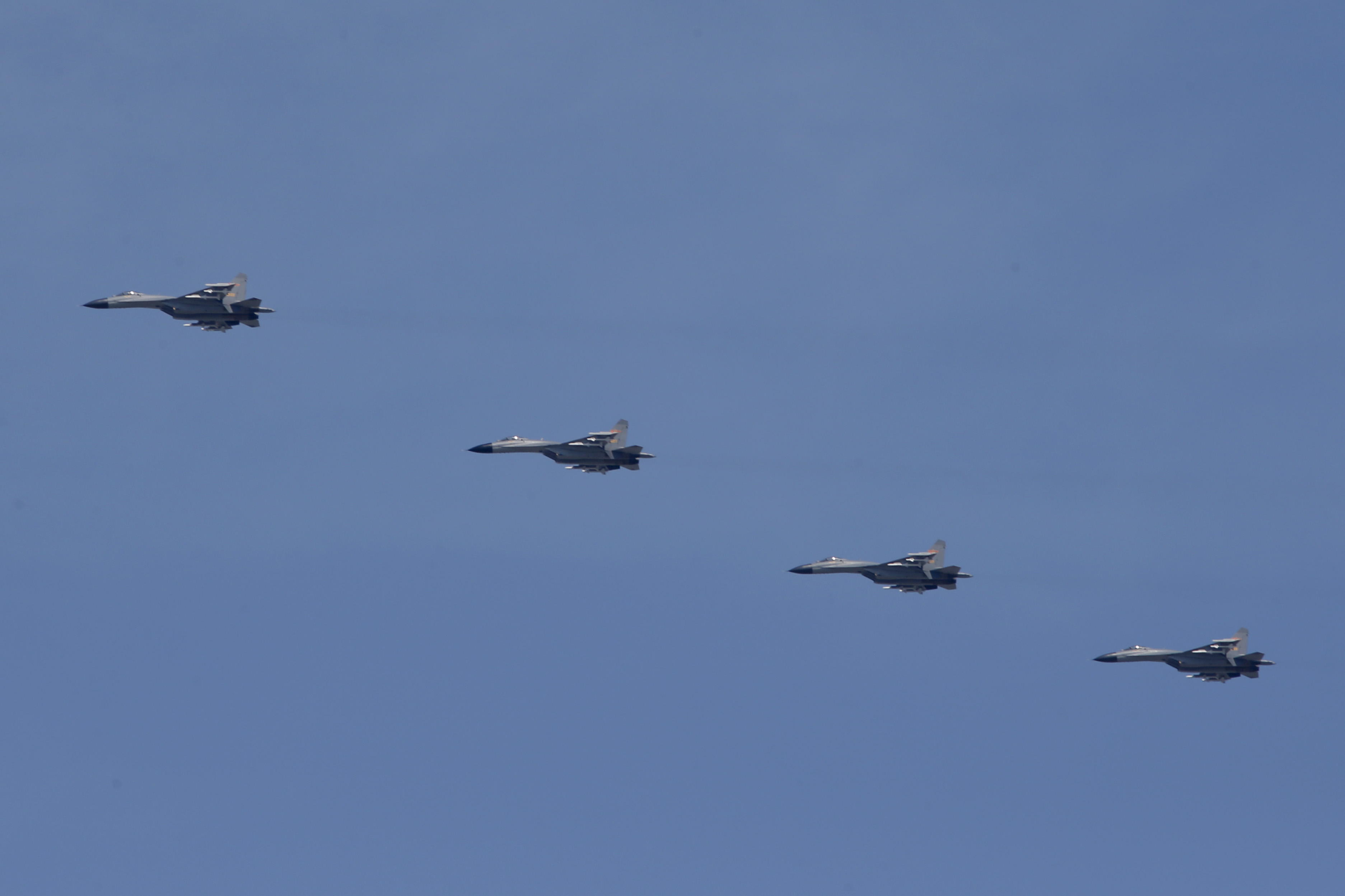 Chinese J-15 fighter jets fly in formation.