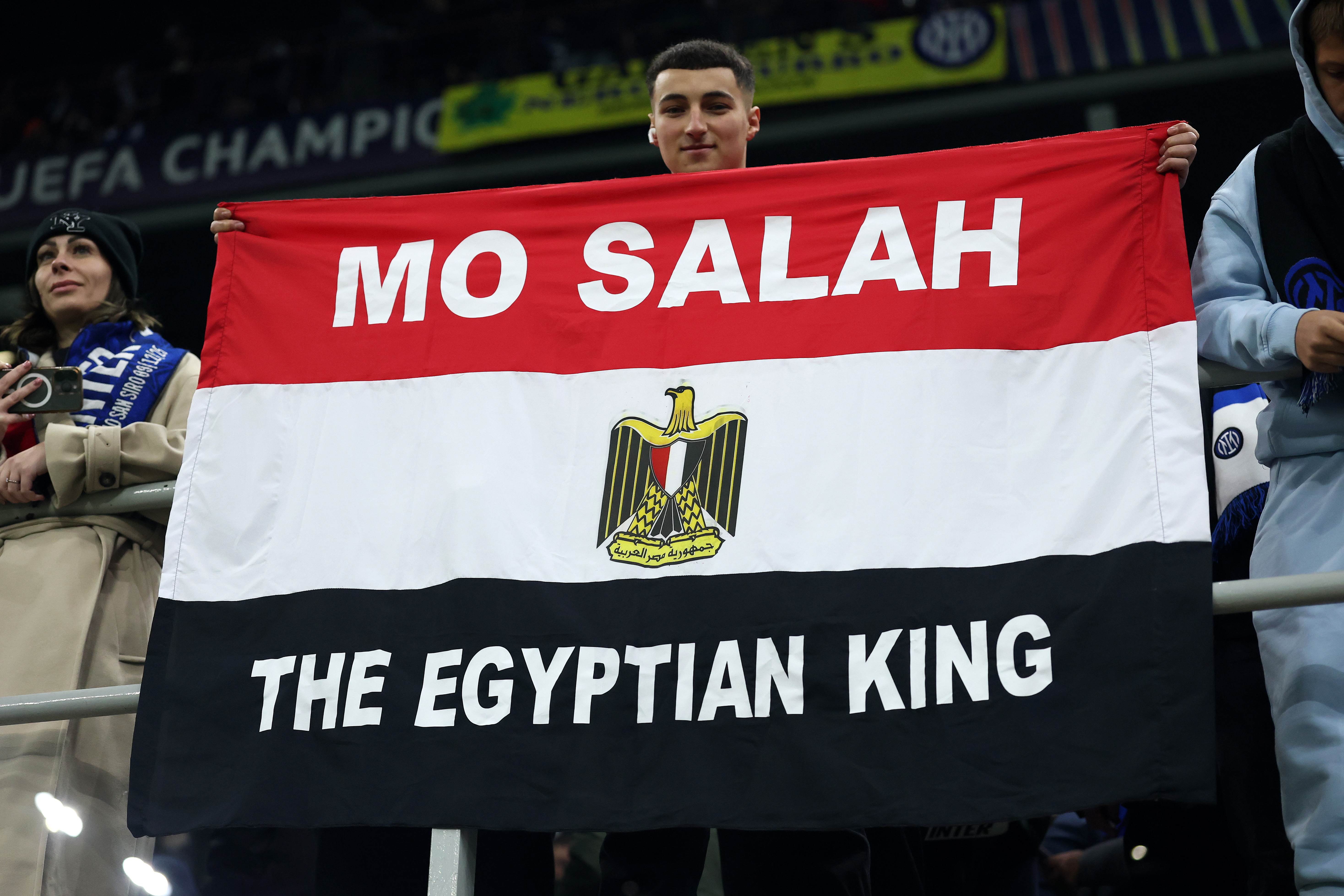 Mohamed Salah fan holds flag.