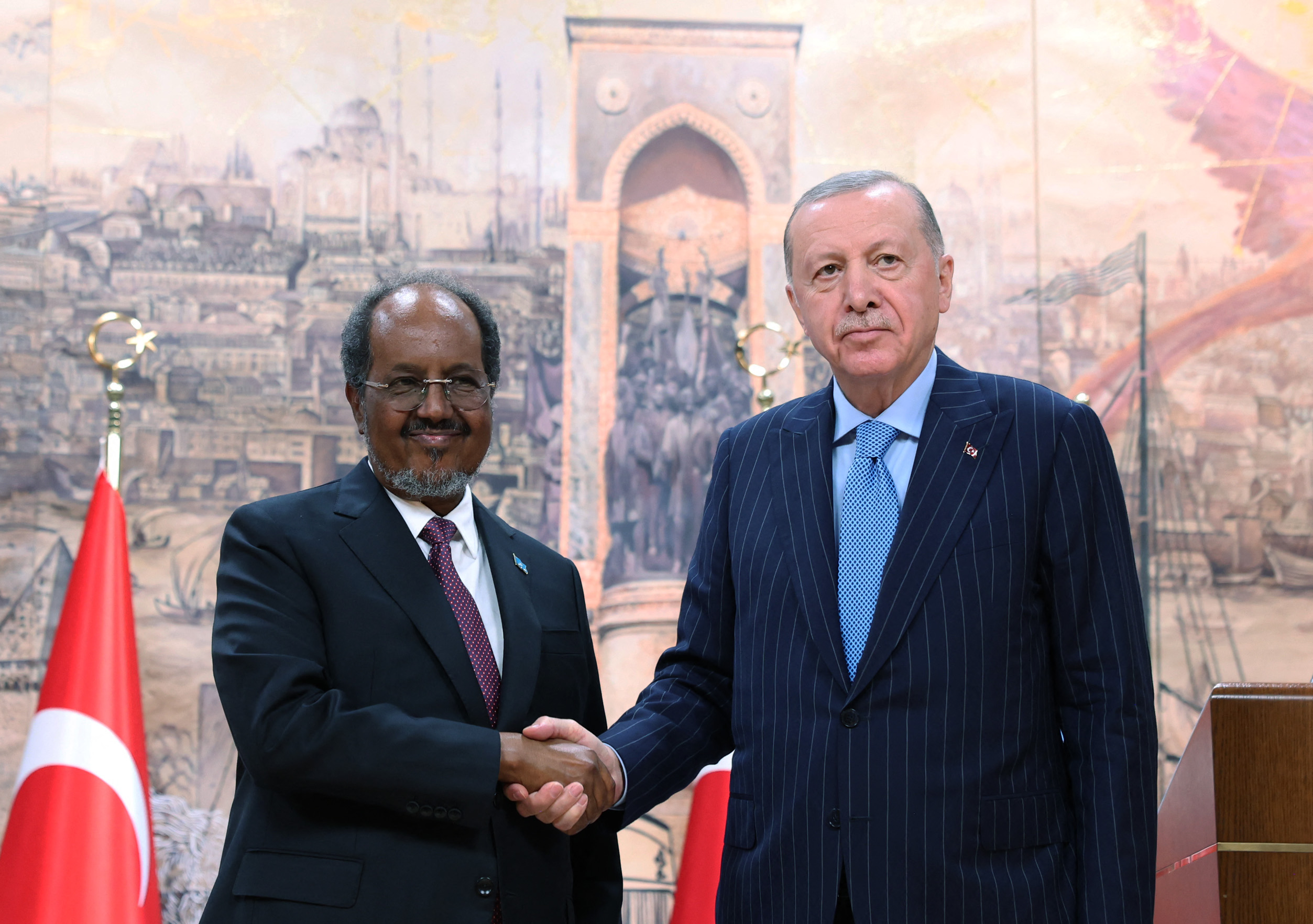 This handout photograph taken and released by the Turkish presidential press service on December 30, 2025, shows Turkish President Recep Tayyip Erdogan (R) and Somalian President Hassan Sheikh Mohamud (L) shaking hands during press conference in Istanbul, Turkey, 30 December 2025.