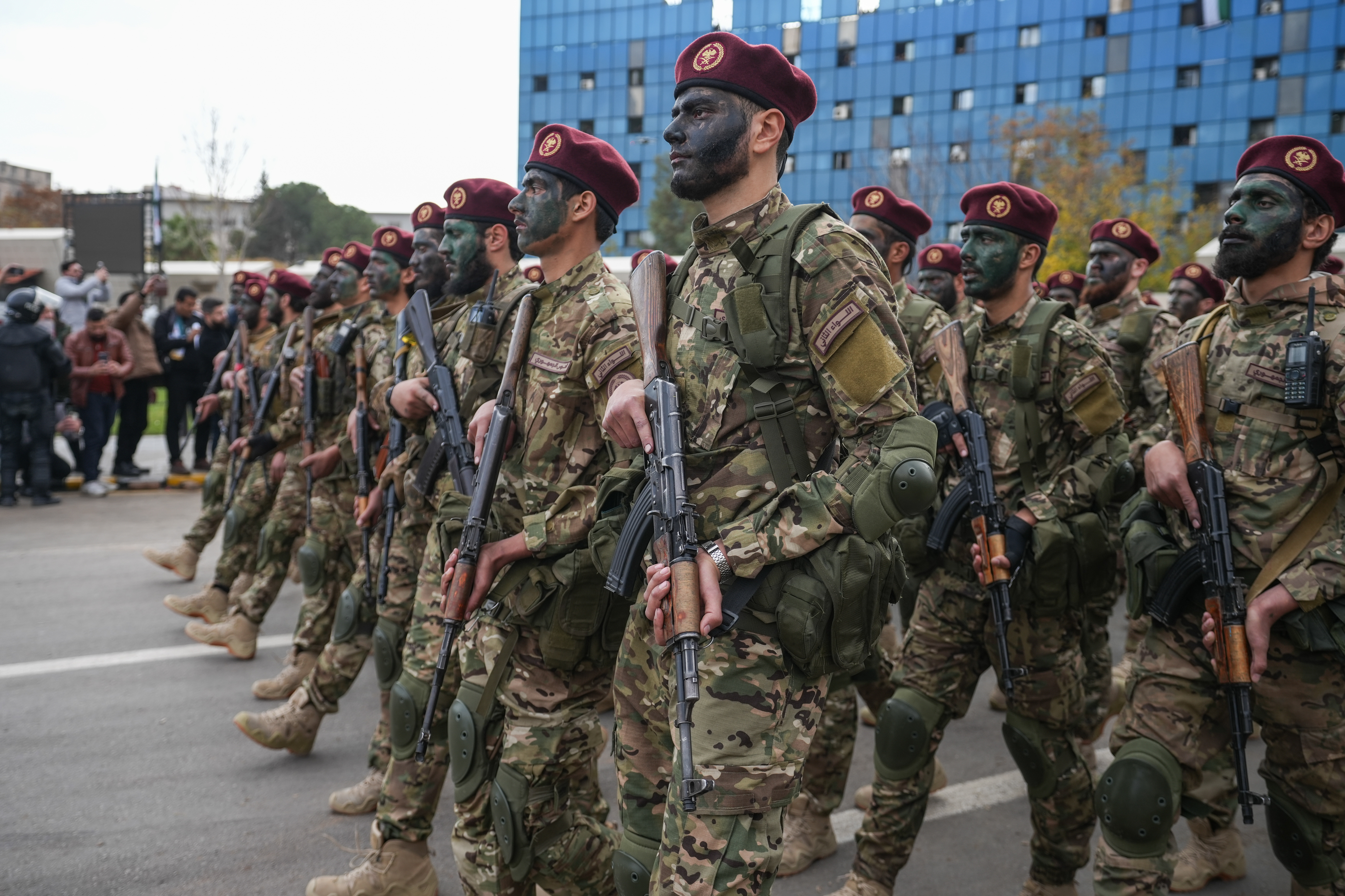 epa12578977 Syrian army soldiers march during a parade marking the first anniversary of the ousting of the Bashar Al-Assad regime in Damascus, Syria, 08 December 2025. Syria marks the first anniversary of the overthrow of the Assad regime on 08 December when the dictatorship of Bashar al-Assad collapsed during a major offensive by opposition forces. EPA/AHMAD FALLAHA