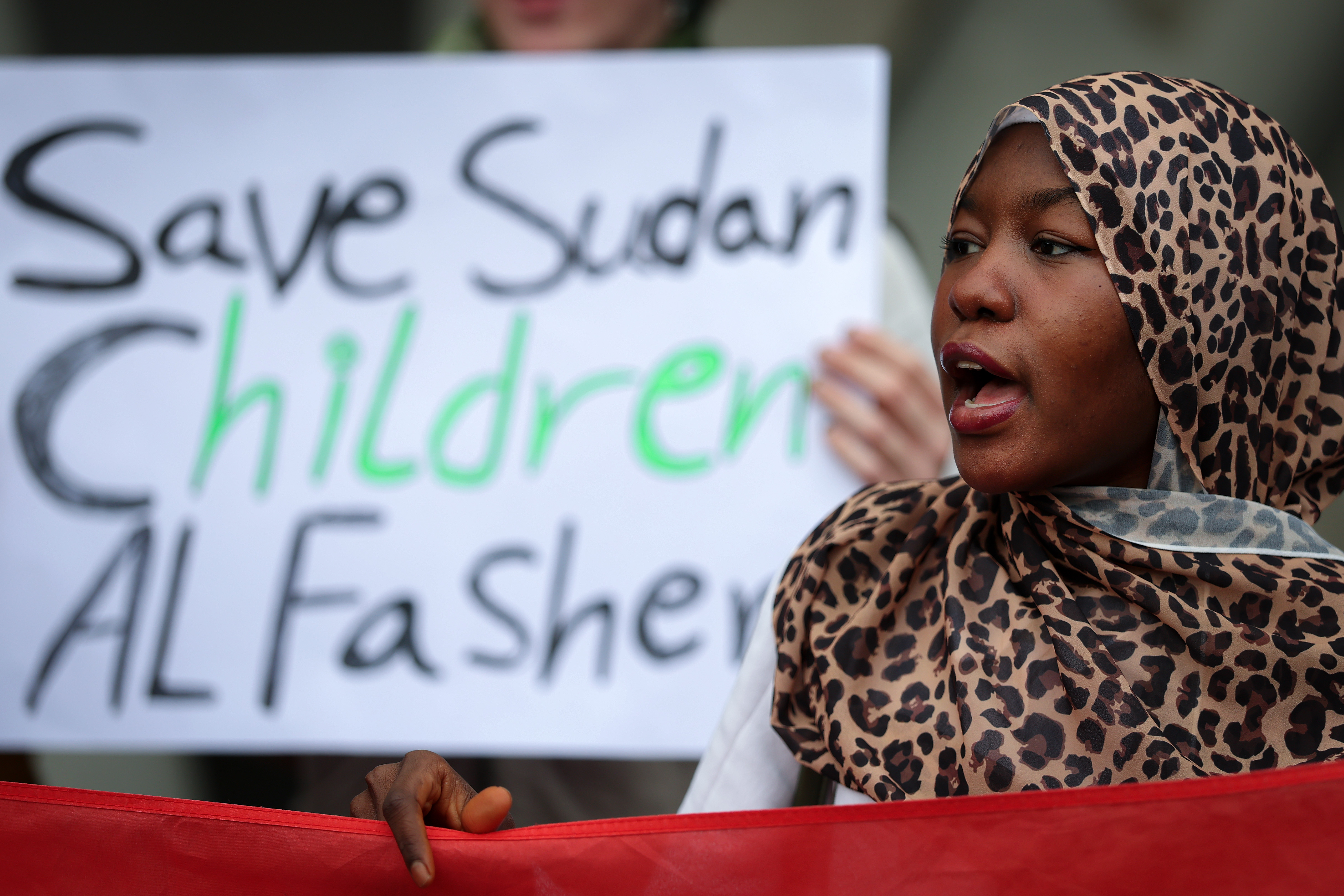EDINBURGH, SCOTLAND - NOVEMBER 06: Protesters gather outside the Scottish Parliament in solidarity with Sudan on November 06, 2025 in Edinburgh, Scotland. A group of Sudanese in Scotland are demonstrating in solidarity with the people in Sudan to raise awareness on the humanitarian crisis that continues to unfold since the conflict began in April 2023. UN Secretary-General António Guterres has sounded the alarm on the recent escalation in El-Fasher, where the paramilitary Rapid Support Forces (RSF) have allegedly carried out mass killings, executions, and sexual violence since overrunning the besieged city in the Darfur region last week. (Photo by Jeff J Mitchell/Getty Images)