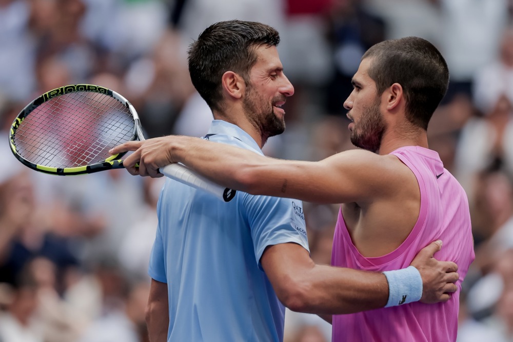 Carlos Alcaraz (R) of Spain greets Novak Djokovic (L) of Serbia after Alcaraz defeated Djokovic during the men's singles semifinals of the US Open Tennis Championships
