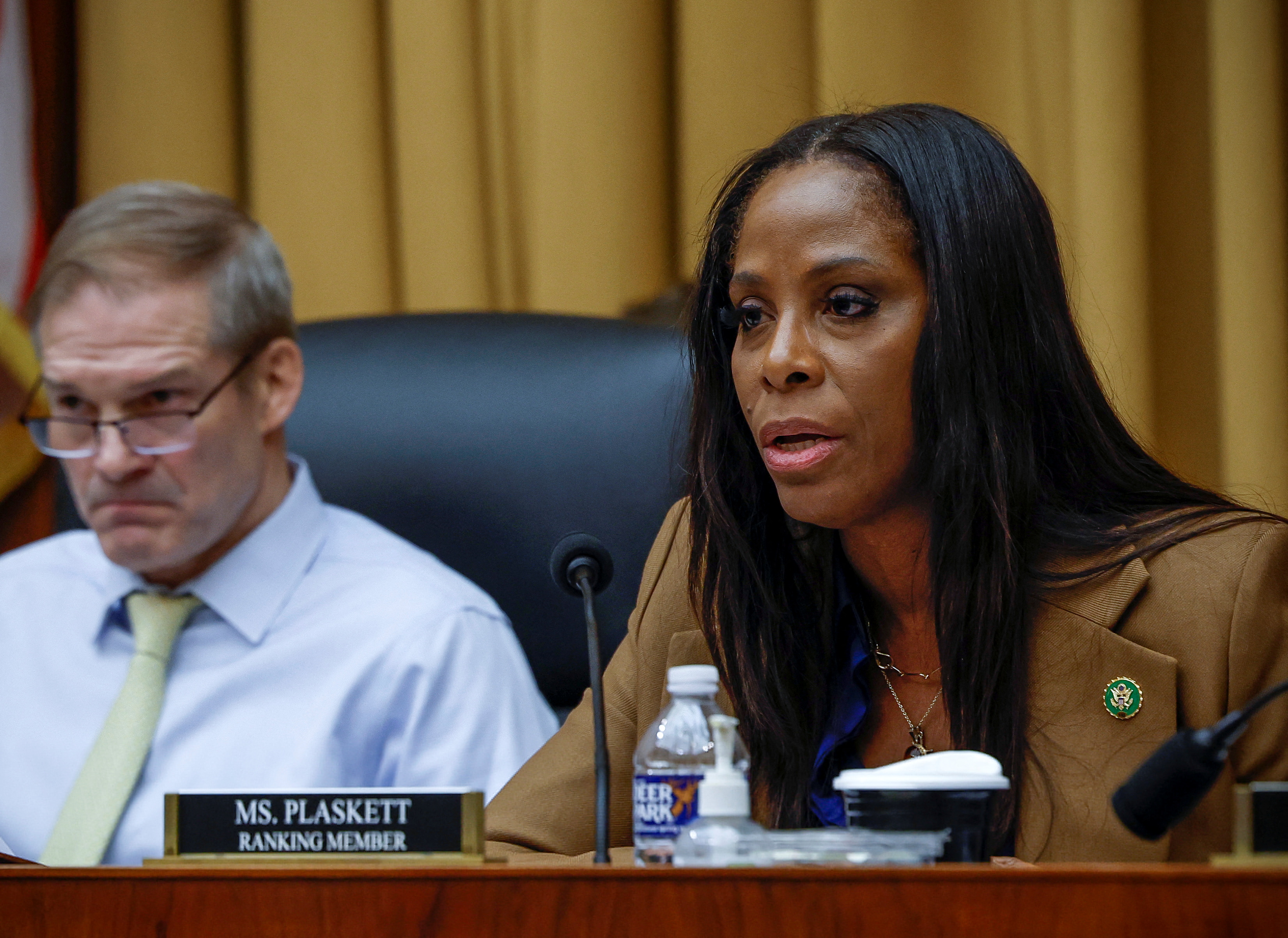 U.S. Representative Stacey Plaskett (D-VI) questions a witness while Representative Jim Jordan (R-OH) looks on, during the House Judiciary Weaponization of the Federal Government Subcommittee hearing about the politicization of the FBI and Department of Justice and attacks on American civil liberties, on Capitol Hill in Washington, U.S., February 9, 2023. REUTERS/Evelyn Hockstein