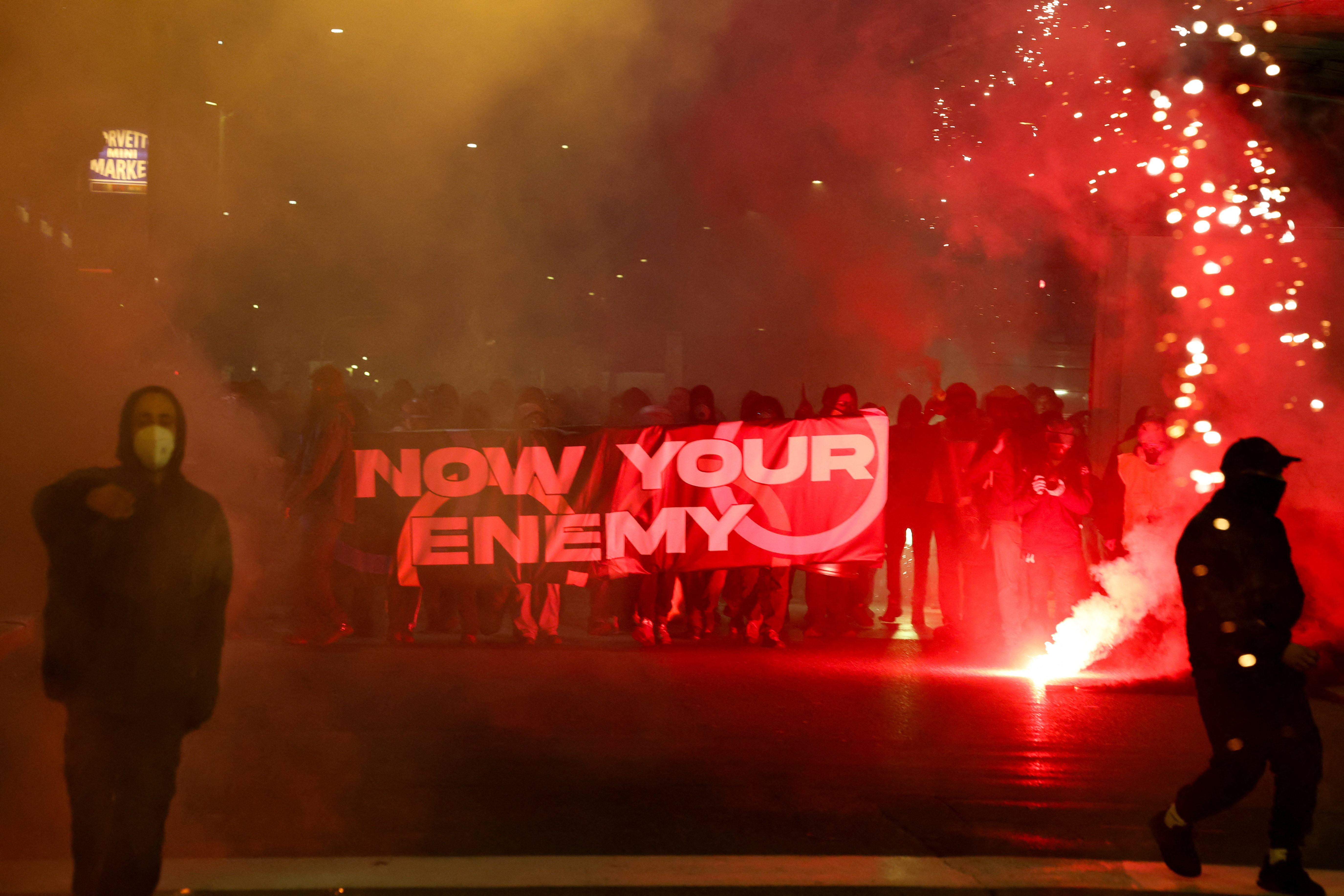 Demonstrators try to block a road
