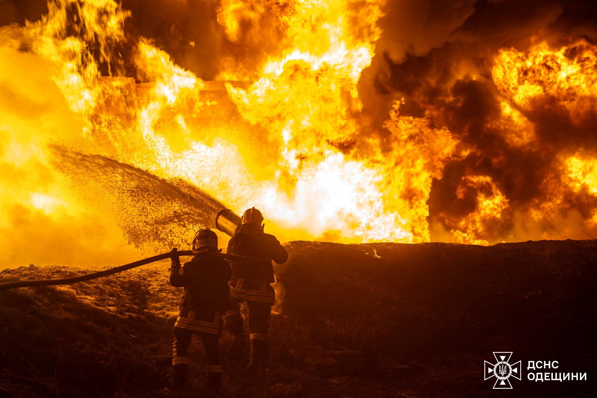 Firefighters work at the site of a railway infrastructure facility hit during overnight Russian drone attacks.