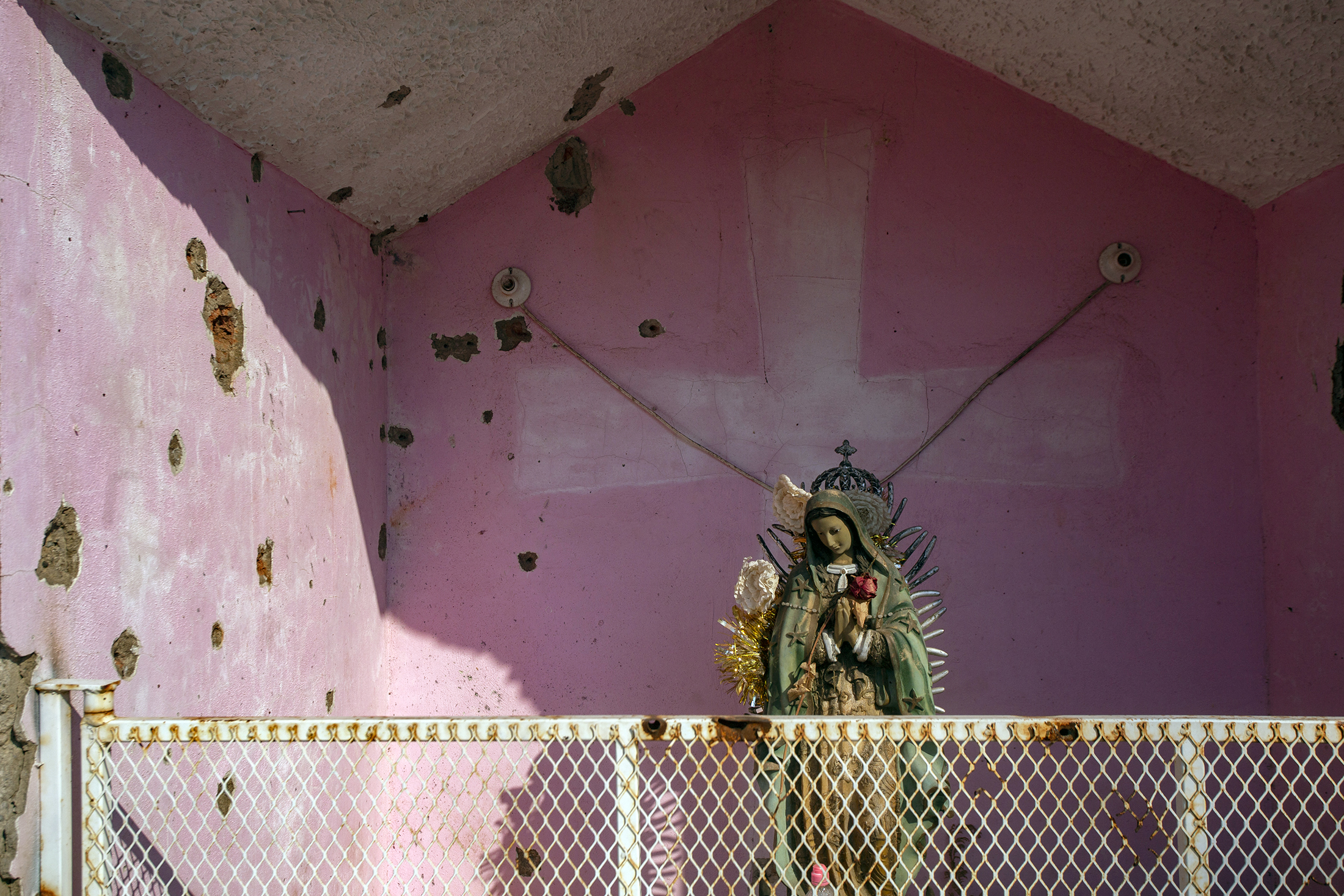 Bullet holes are seen in a sanctuary at El Aguaje community, after a confrontation between Los Viagras Cartel and the Jalisco Nueva Generacion Cartel,