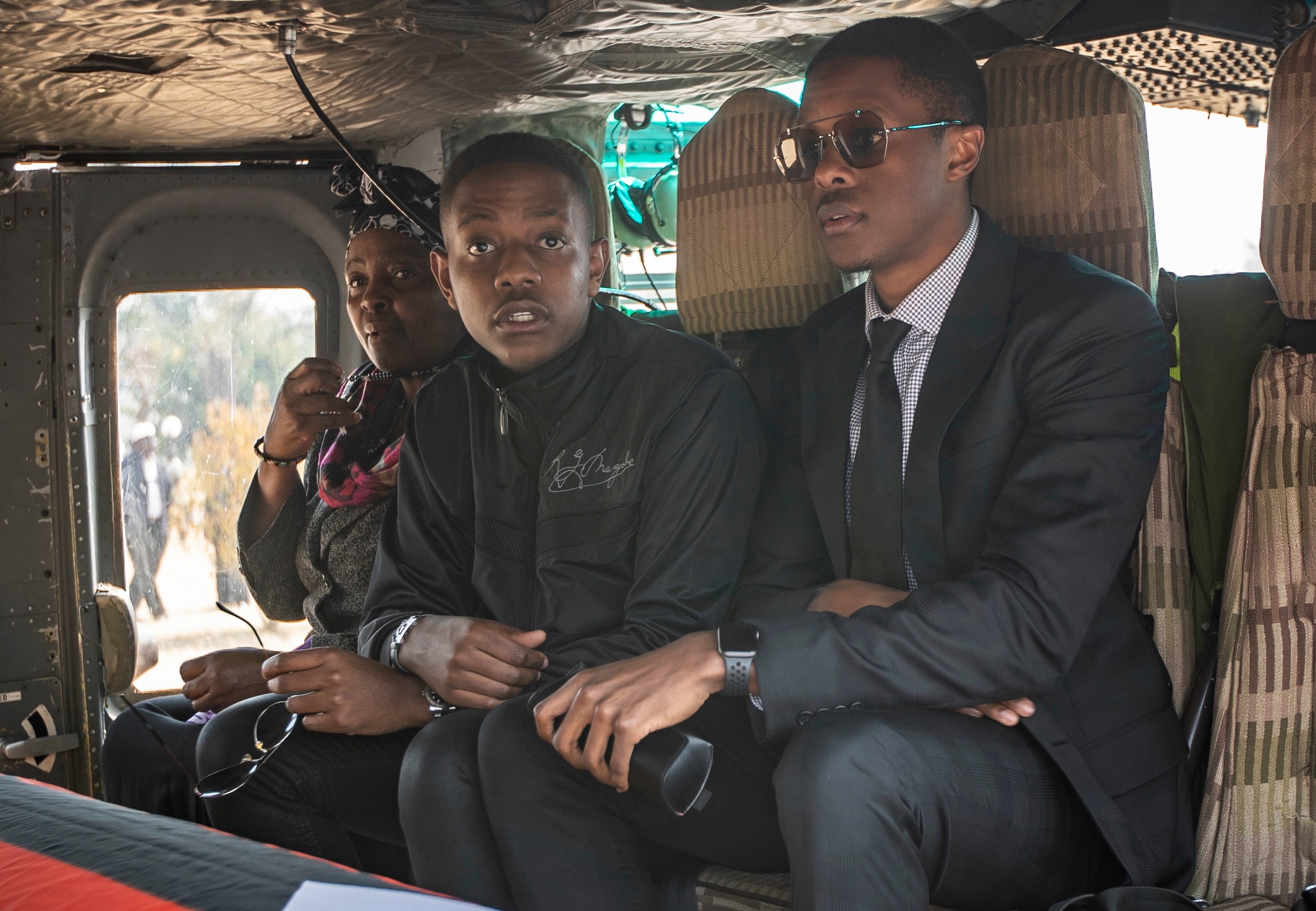 Bellarmine Chatunga Mugabe sat with his brother Robert Mugabe Junior