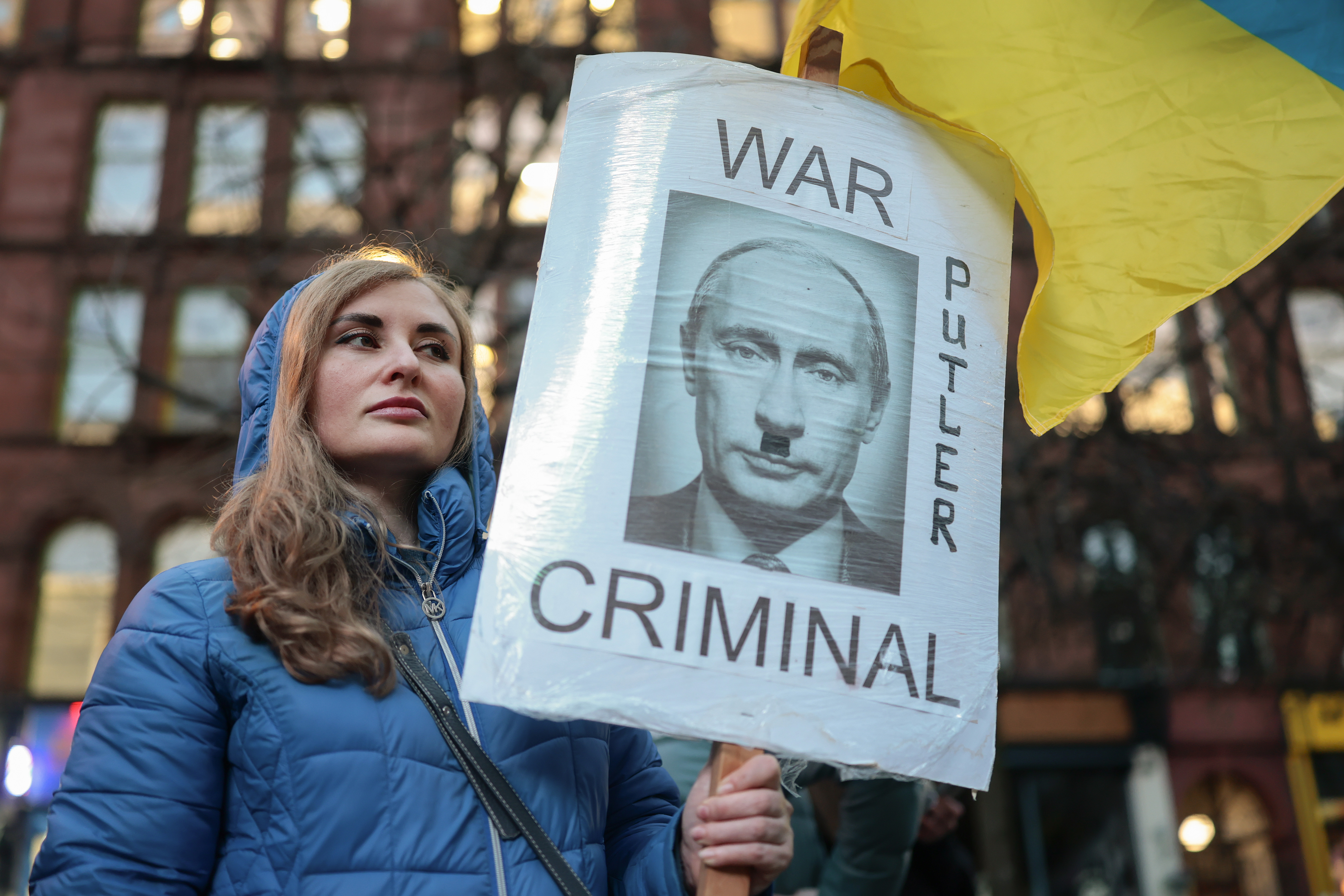 GLASGOW, SCOTLAND - FEBRUARY 24: Members of the public gather in St Enoch Square to mark the fourth anniversary of the Russian invasion of Ukraine on February 24, 2026 in Glasgow, Scotland. Demonstrations in solidarity with Ukraine are taking place around the world, as Ukraine prepares to mark the grim milestone of four years at war, following the launch of Russia's full-scale invasion on February 24, 2022. (Photo by Jeff J Mitchell/Getty Images)