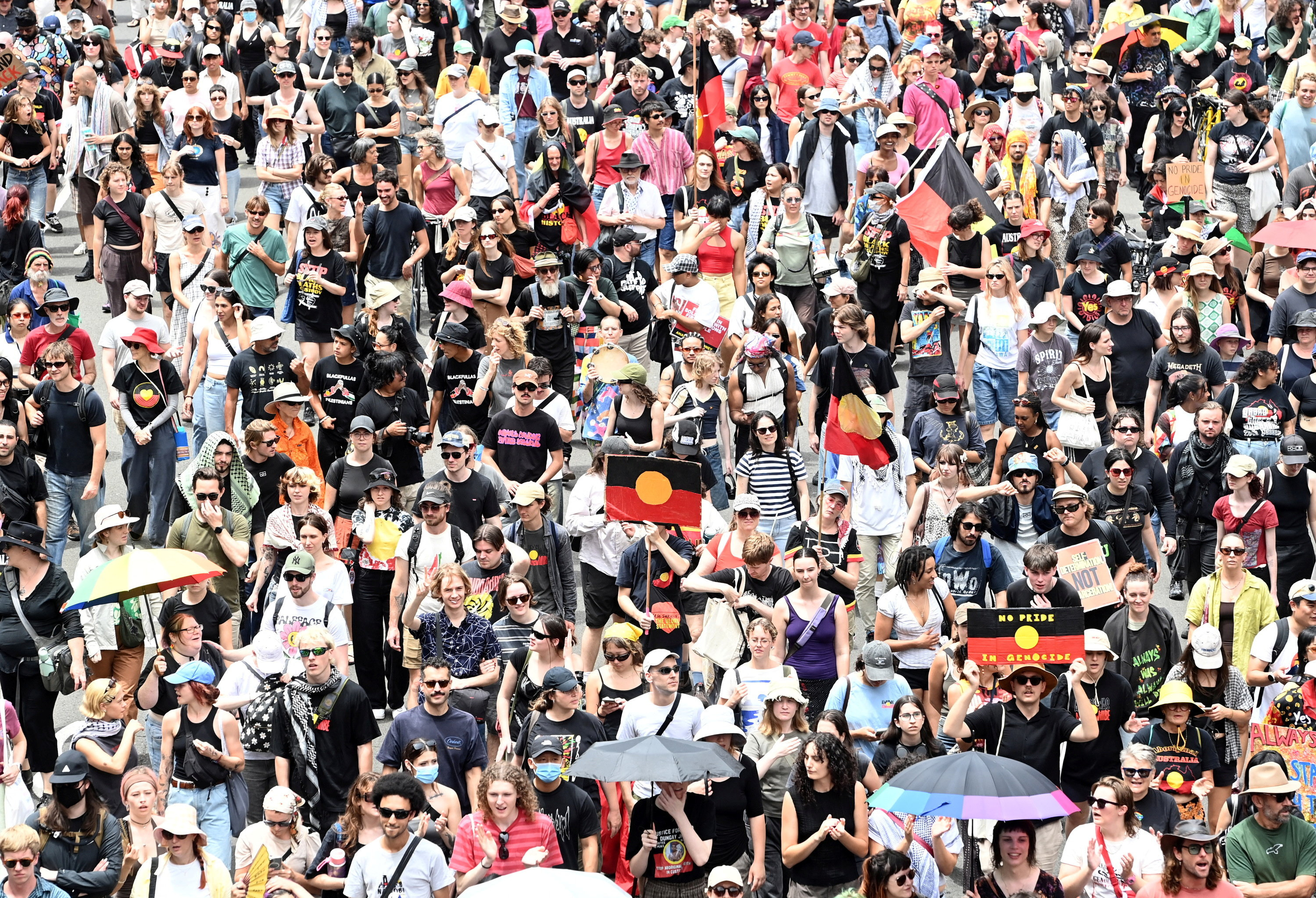 People take part in the Invasion Day protest march through Sydney during Australia Day 2026 celebrations