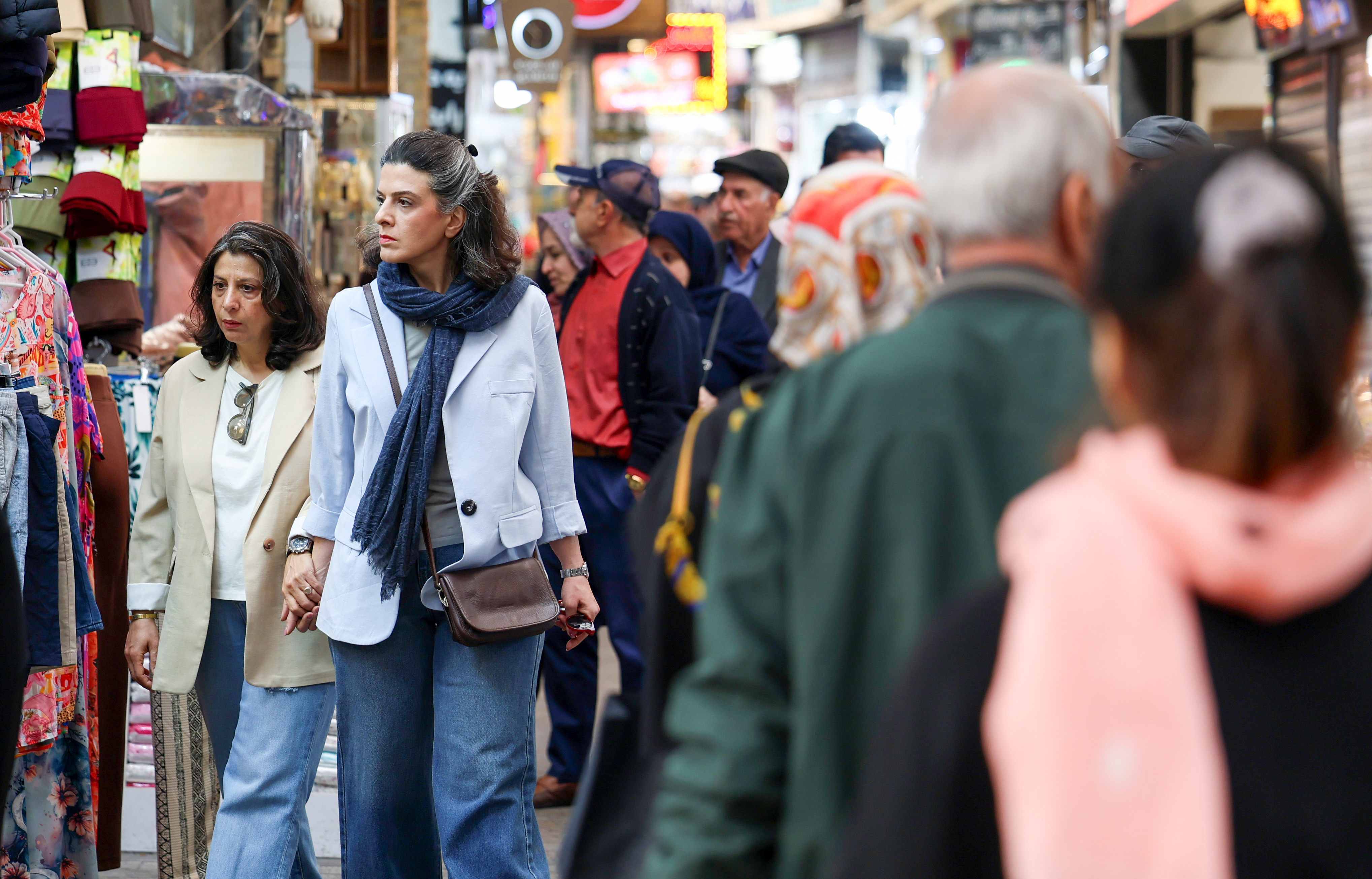 Iranians shop in a bazaar in Tehran