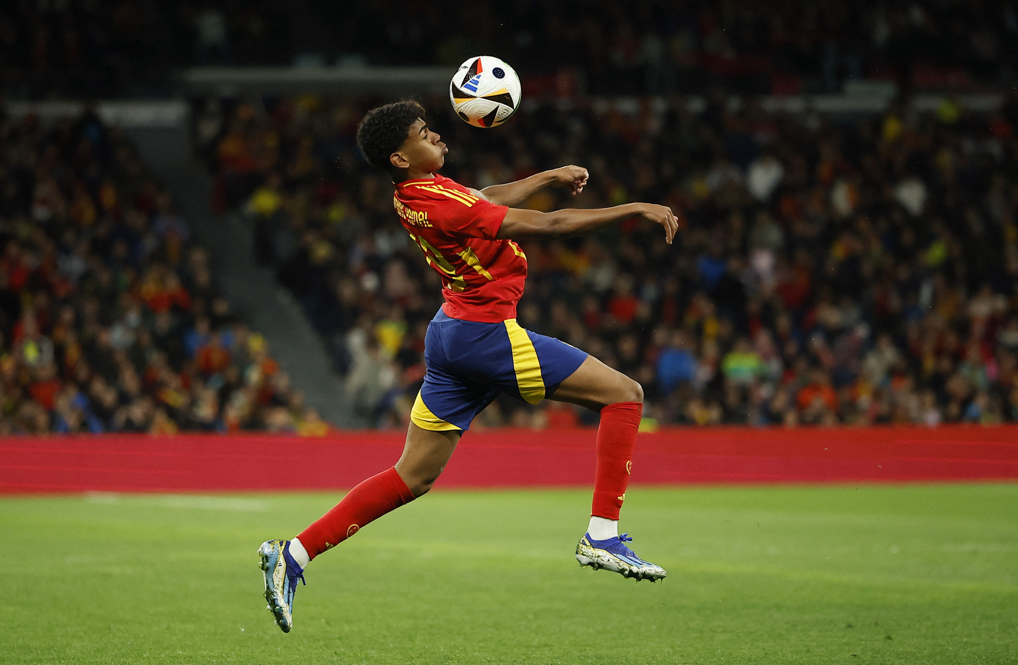 Spain's Lamine Yamal in action