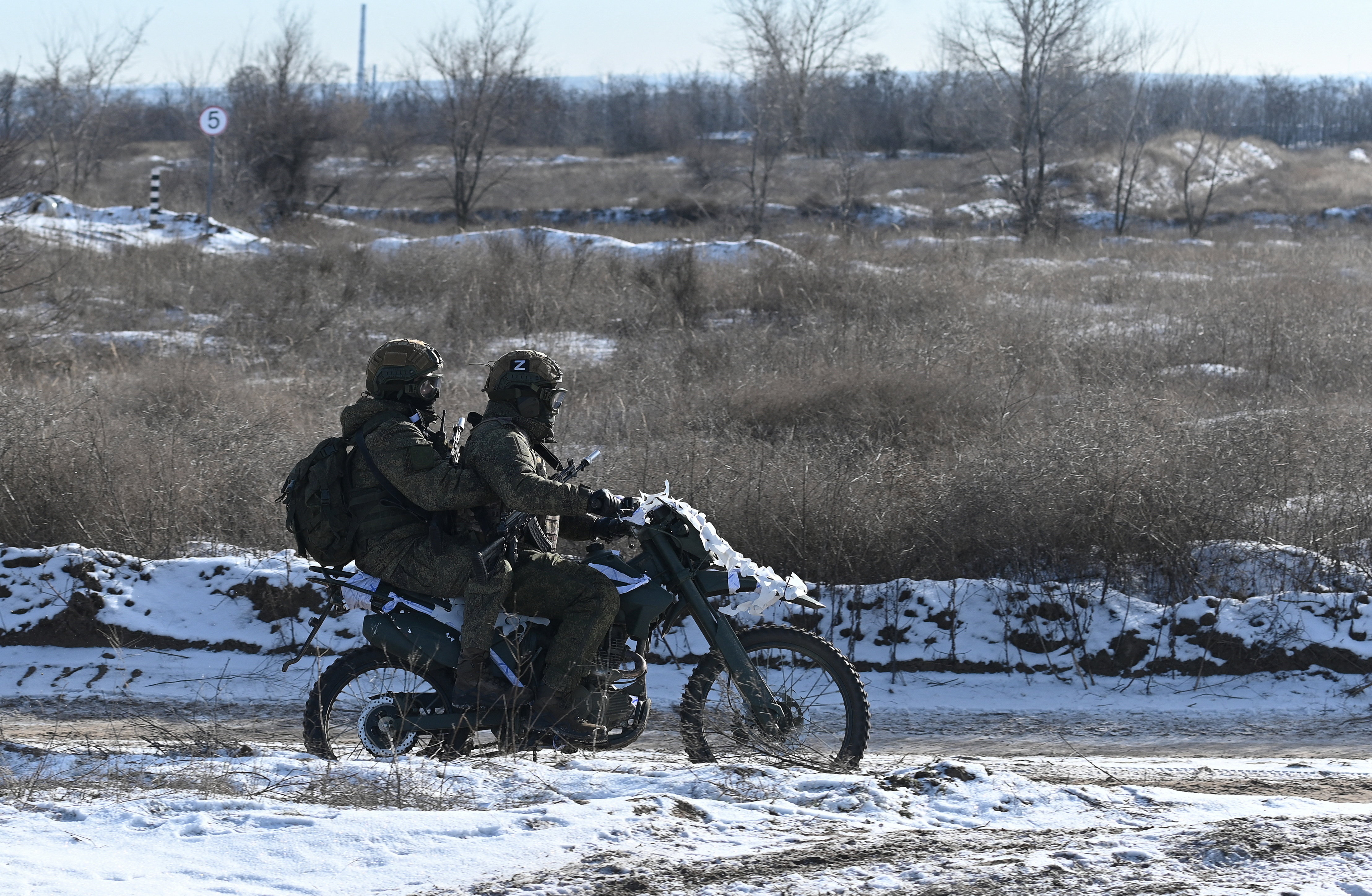 Russian service members of a separate engineering unit of the Southern Military District ride a motorcycle while undergoing an intensive combat training course to improve their skills in setting up barriers, clearing terrain of mines and crossing water obstacles, amid the Russia-Ukraine conflict at a firing range in the Rostov region, Russia, January 19, 2026. REUTERS/Sergey Pivovarov