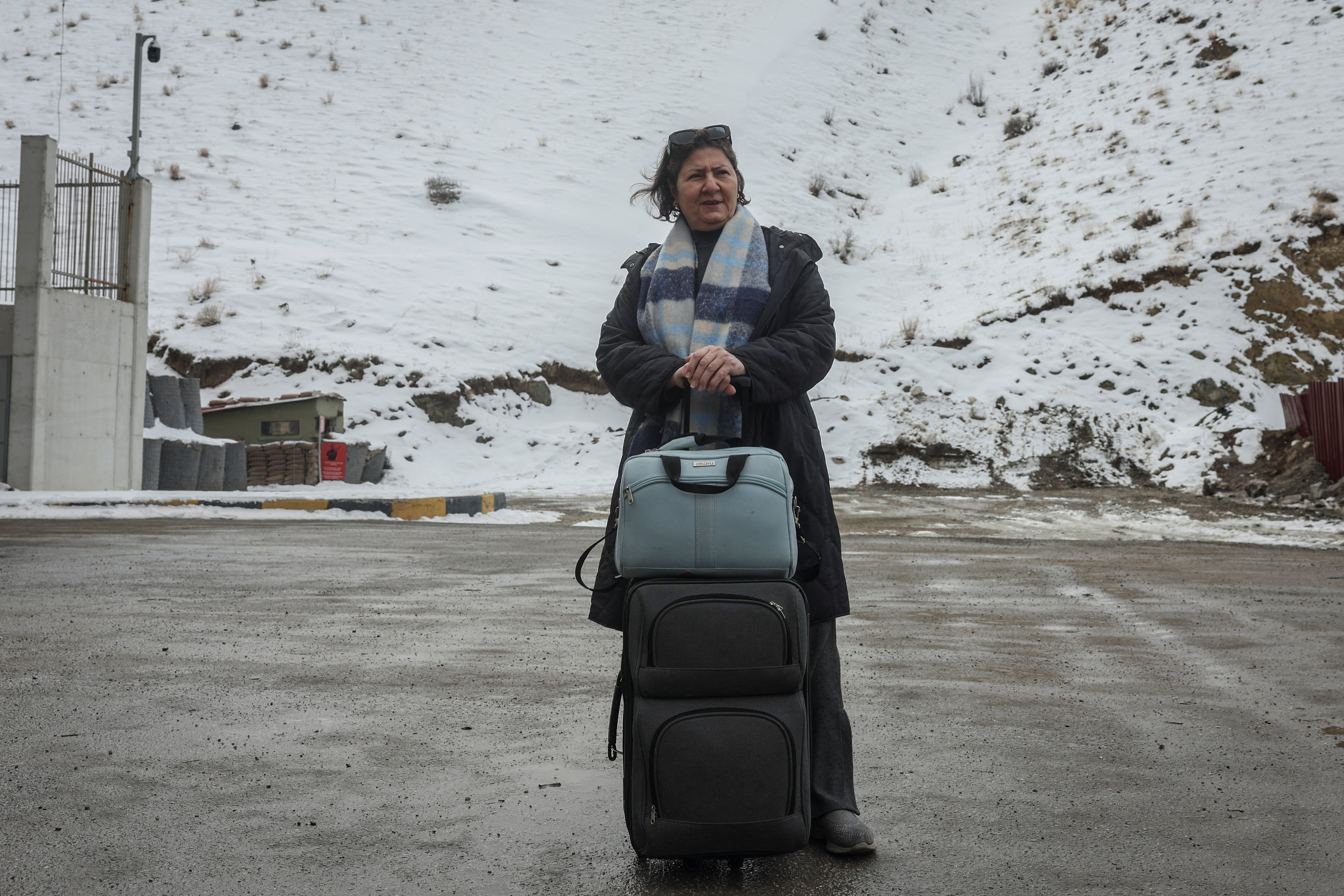 Iranians make their way after crossing into Turkey at the Kapikoy Border Gate in the eastern Van province