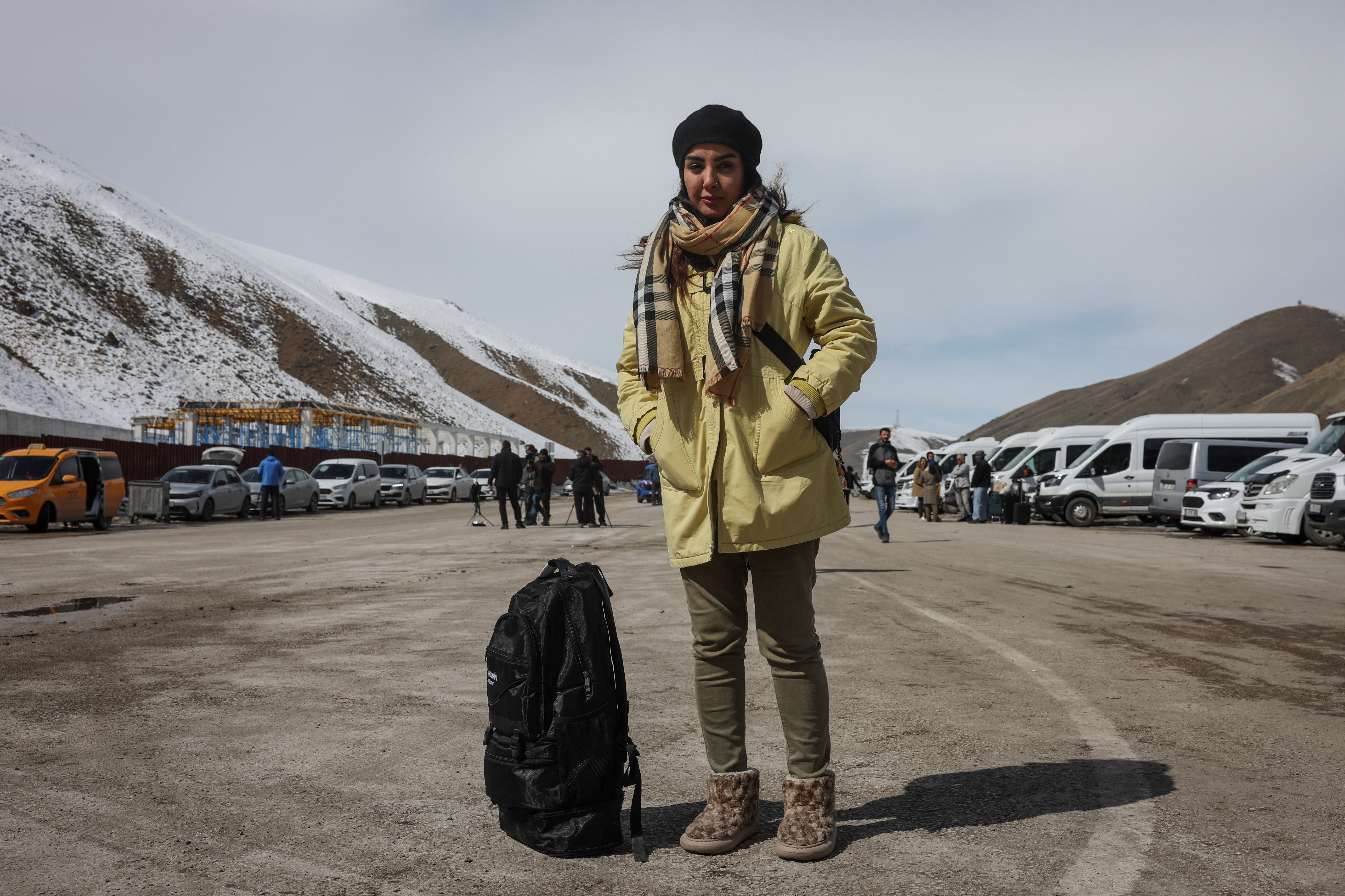 Iranians make their way after crossing into Turkey at the Kapikoy Border Gate in the eastern Van province