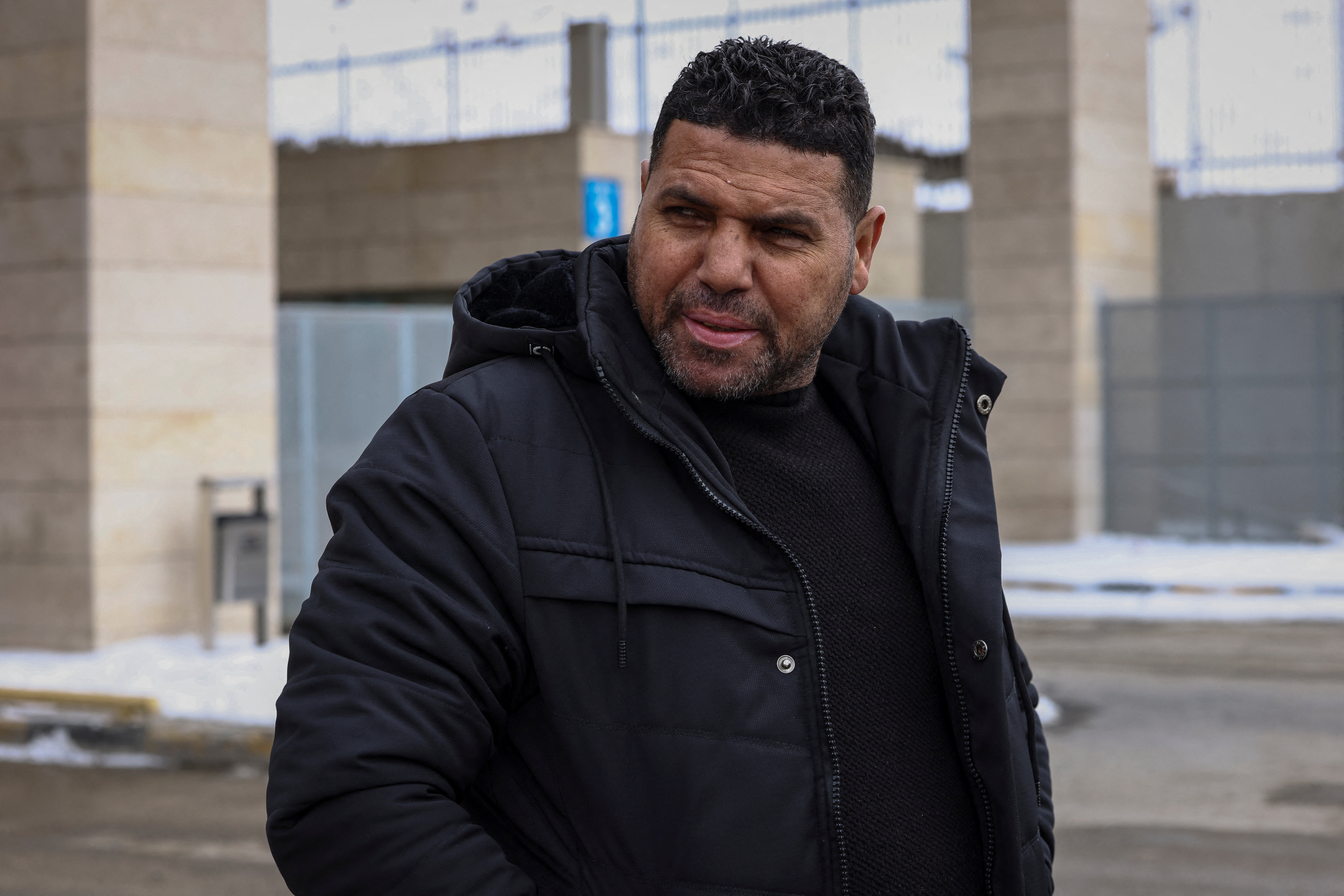 Iranians make their way after crossing into Turkey at the Kapikoy Border Gate in the eastern Van province