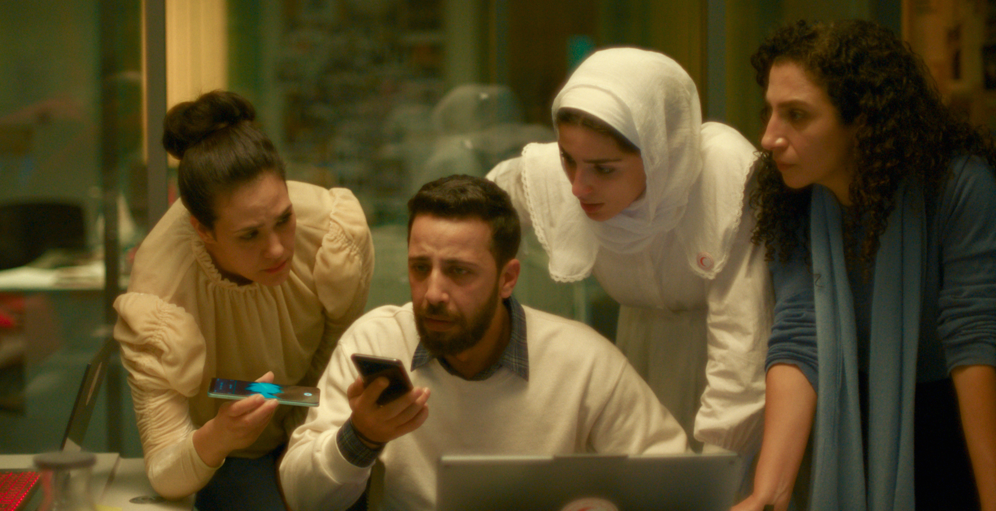 This image released by CineCANÍBAL, shows the actors Nesbat Serhan, Motaz Malhees, Saja Kilani and Clara Khoury in a scene from the film "The Voice of Hind Rajab"