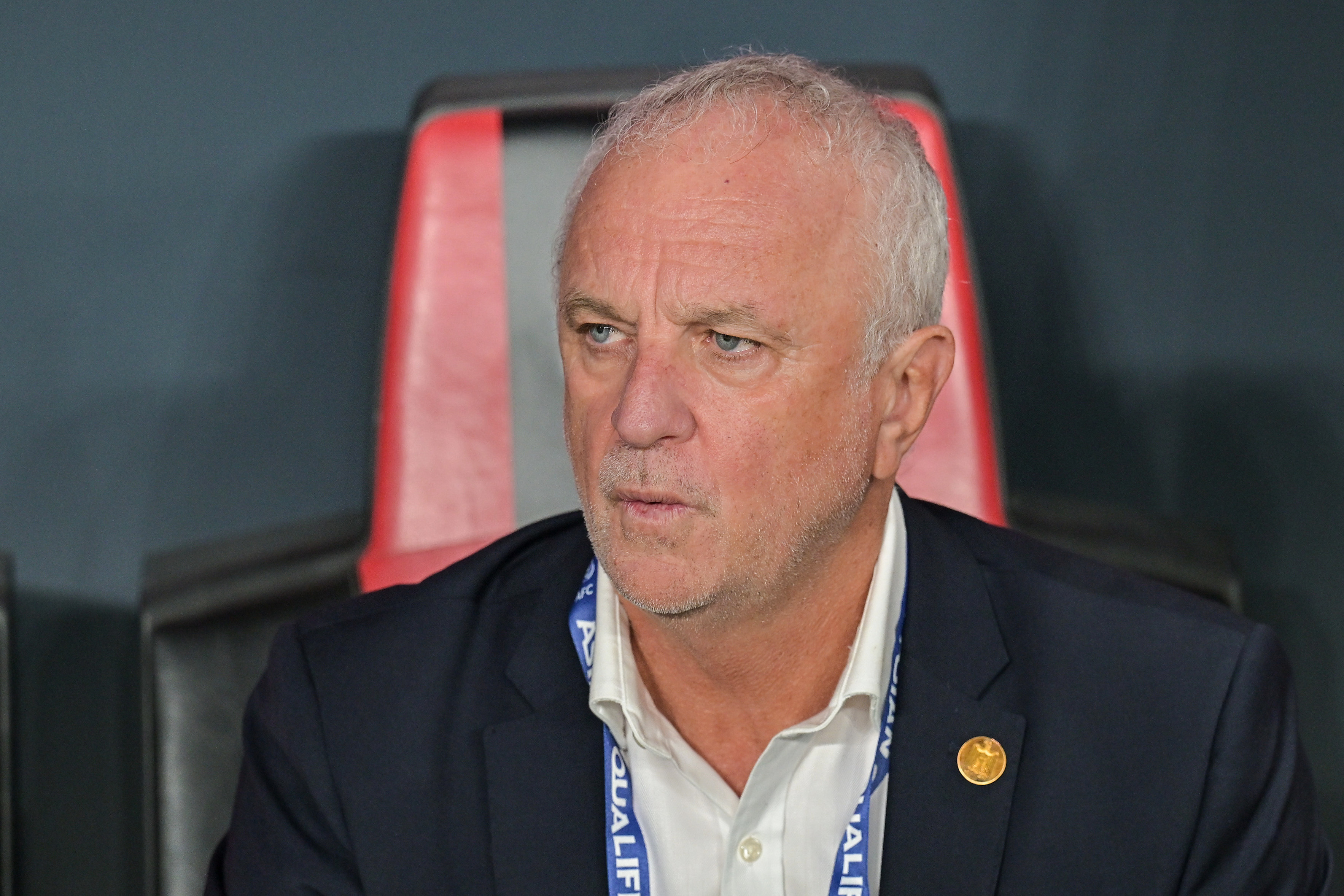 Iraqi's head coach Graham Arnold sits on the bench at the start of the 2026 World Cup play off first leg soccer match between UAE and Iraq