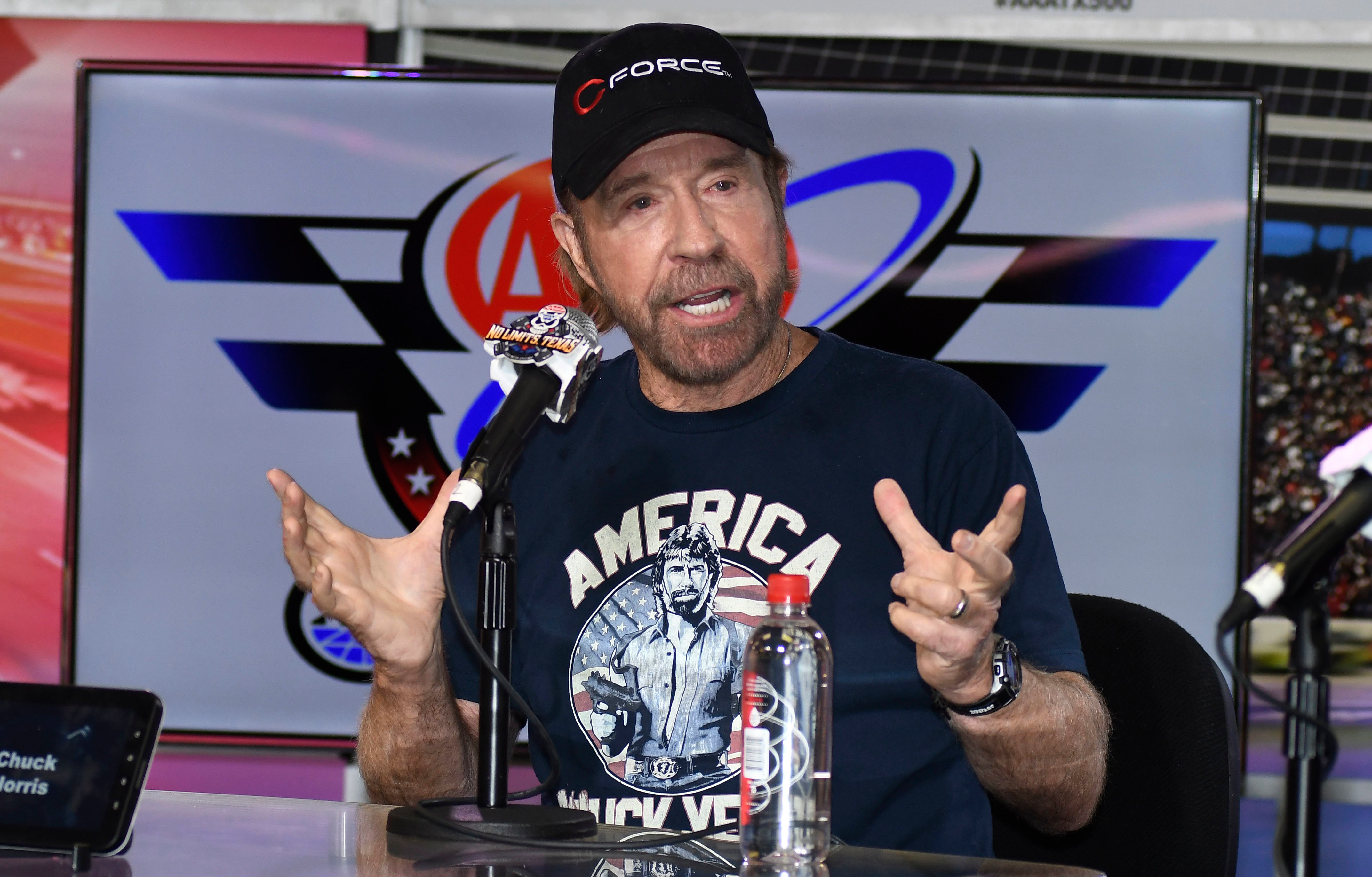 Chuck Norris speaks to reporters during a media availability before the NASCAR Sprint Cup Series 