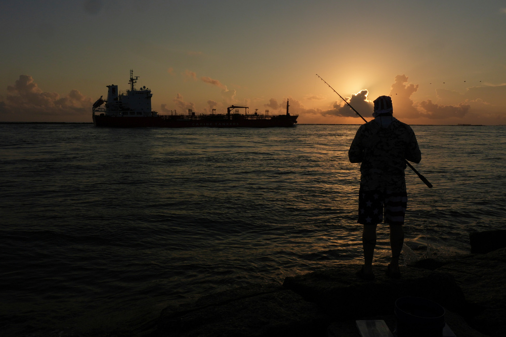A man fishes in the Gulf