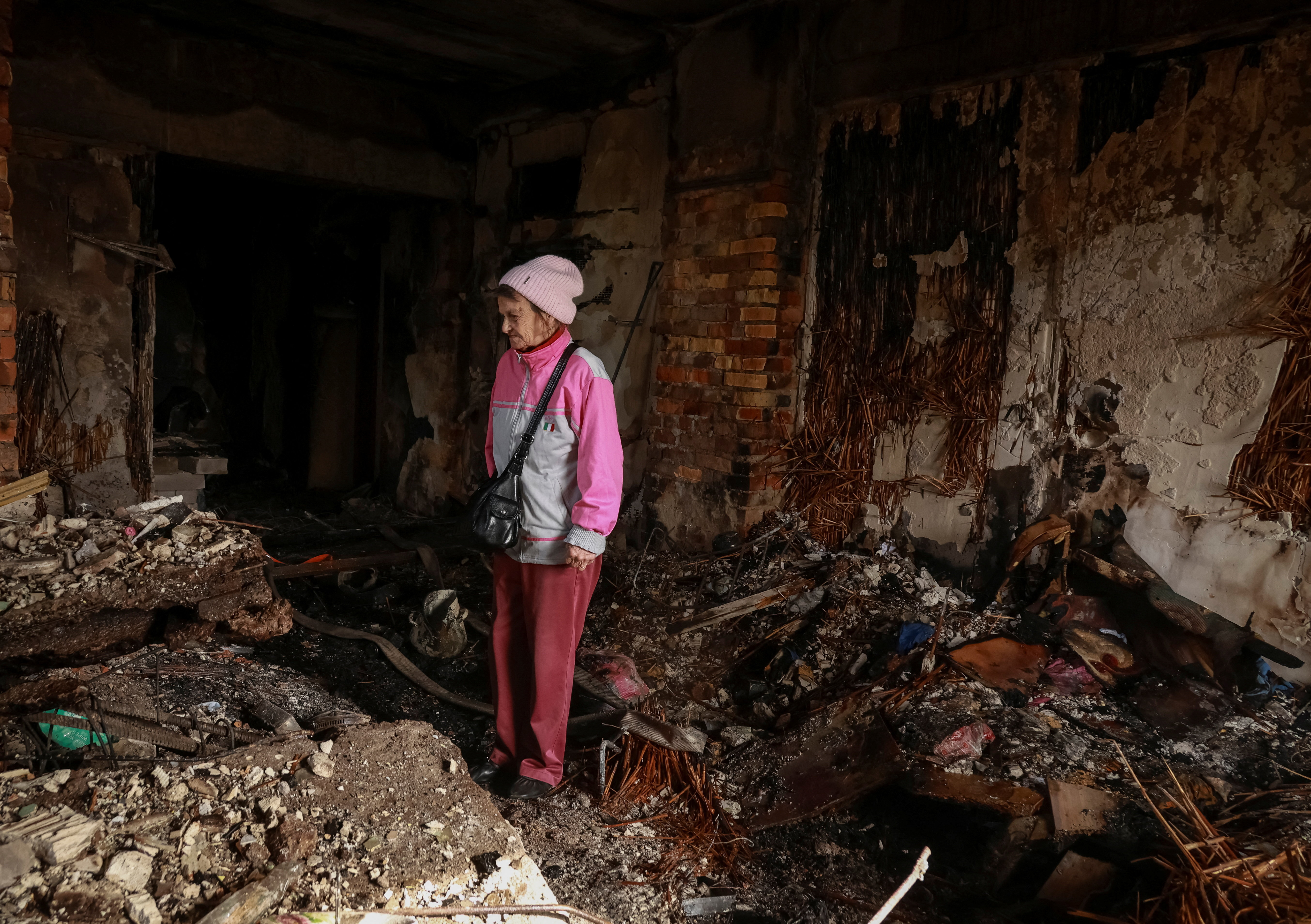 A resident stands in her room in a dormitory hit by a Russian drone strike, amid Russia's attack on Ukraine, in Odesa, Ukraine April 30, 2026. REUTERS/Nina Liashonok TPX IMAGES OF THE DAY