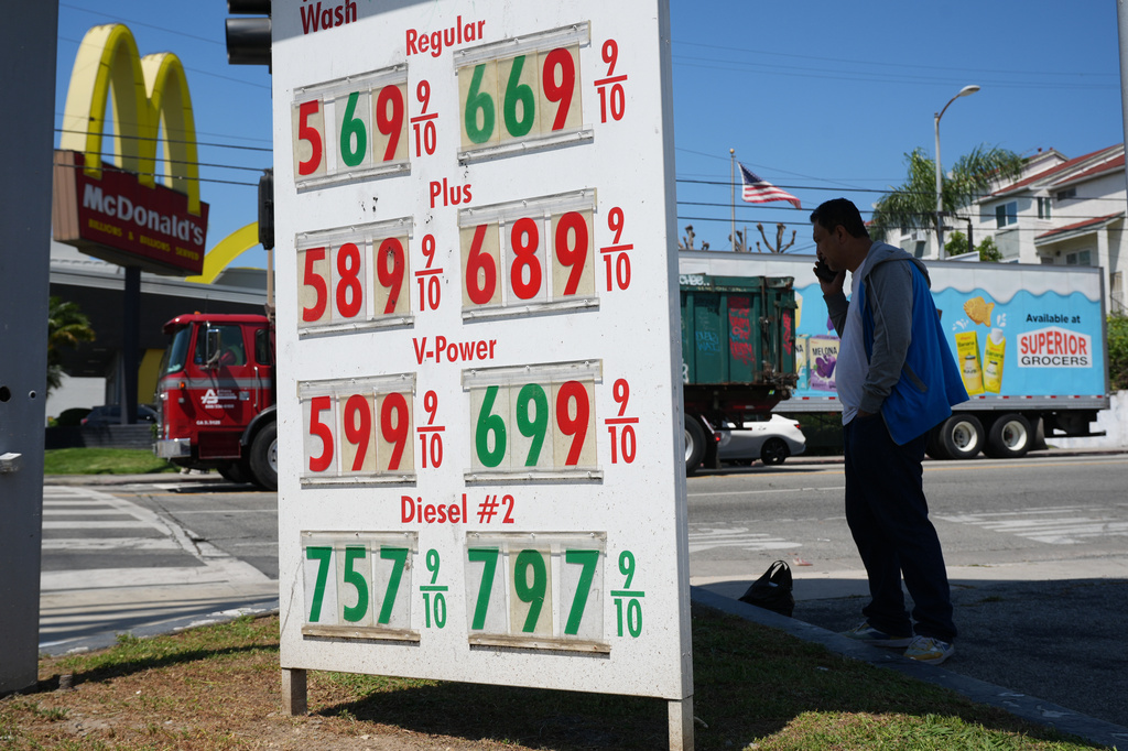 Gas prices are displayed at a gasoline station.