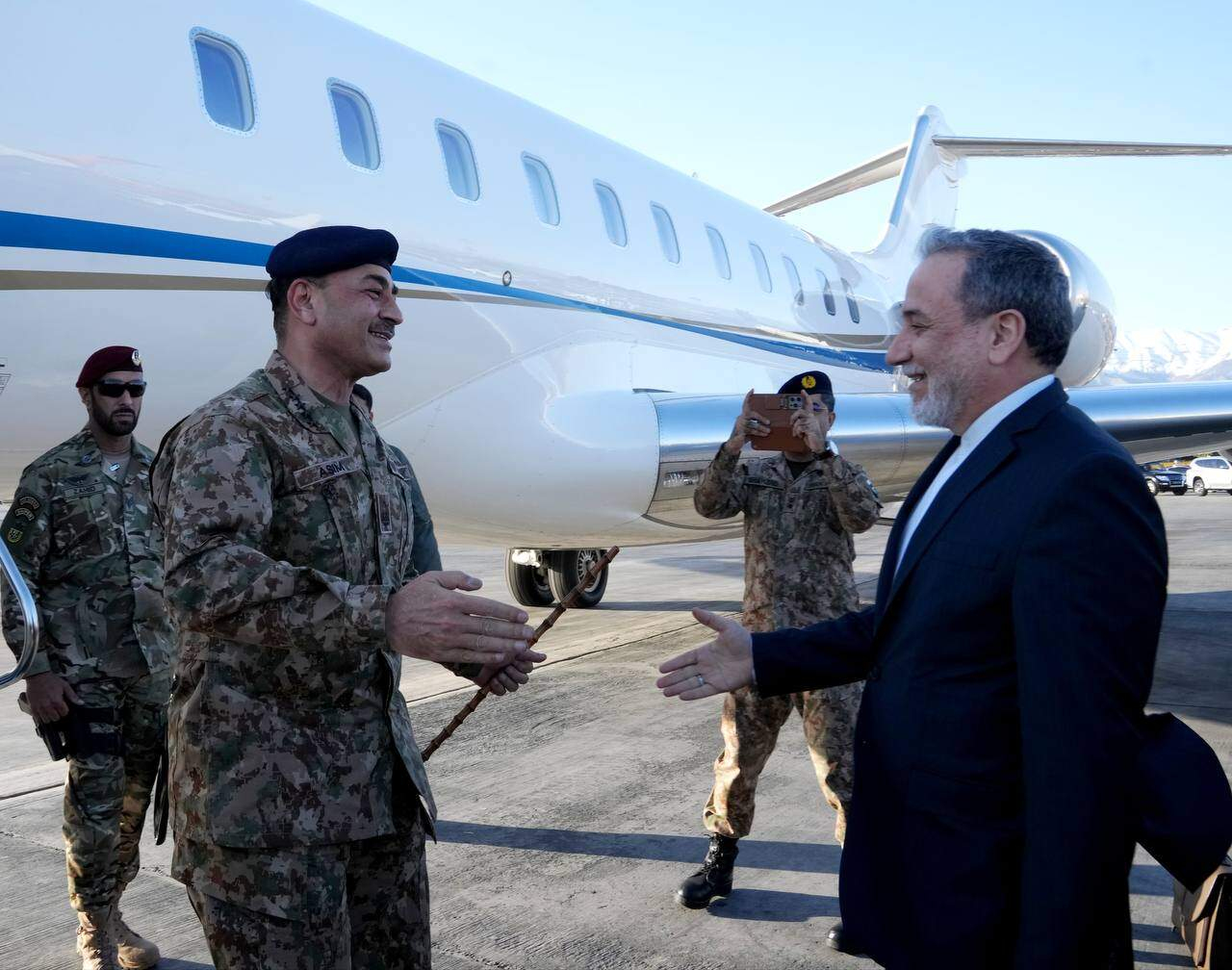 In this photo released by Telegram channel of the Iranian Foreign Minister Abbas Araghchi, Foreign Minister Abbas Araghchi, right, welcomes Pakistan's Army Chief Field Marshal Gen. Asim Munir upon his arrival in Tehran, Iran, Wednesday, April 15, 2026. (Telegram channel of the the Iranian Foreign Minister Abbas Araghchi, via AP)