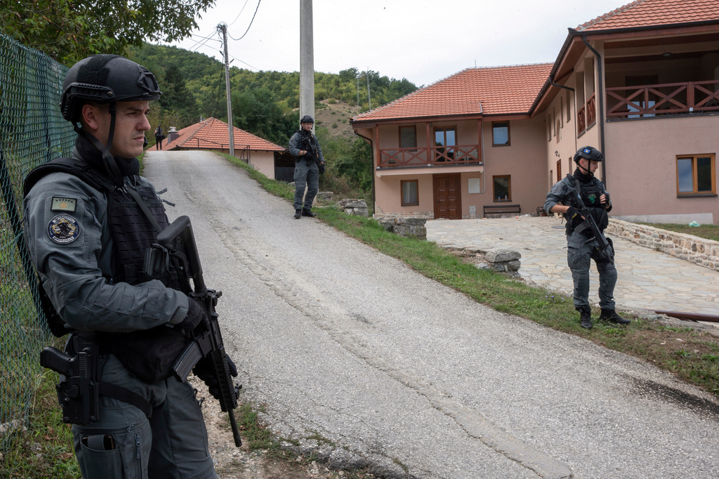 Police officers secure a street.