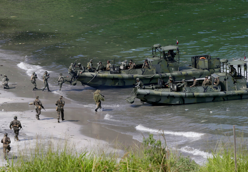 US Marines from the 3rd Marine Expeditionary Brigade and the 31st Marine Expeditionary Unit and Philippine Marines take part in a boat raid exercise during a joint military exercise [File:Bullit Marquez/AP Photo]