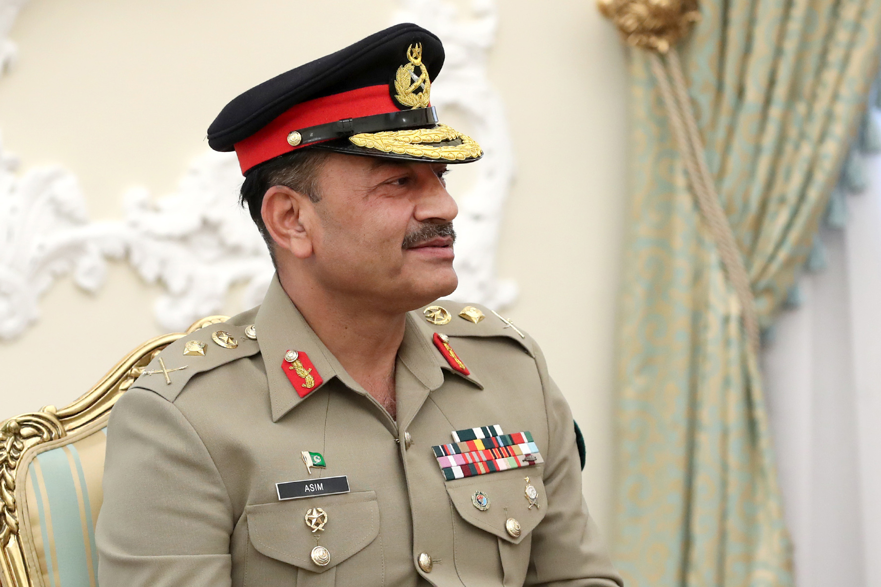 TEHRAN, IRAN - JULY 16: (----EDITORIAL USE ONLY - MANDATORY CREDIT - 'IRANIAN PRESIDENCY / HANDOUT' - NO MARKETING NO ADVERTISING CAMPAIGNS - DISTRIBUTED AS A SERVICE TO CLIENTS----) Iranian President Ebrahim Raisi meets Pakistani Pakistani army general and Chief of Army Staff Syed Asim Munir Ahmed Shah in Tehran, Iran on July 16, 2023. (Photo by IRANIAN PRESIDENCY/Anadolu Agency via Getty Images)