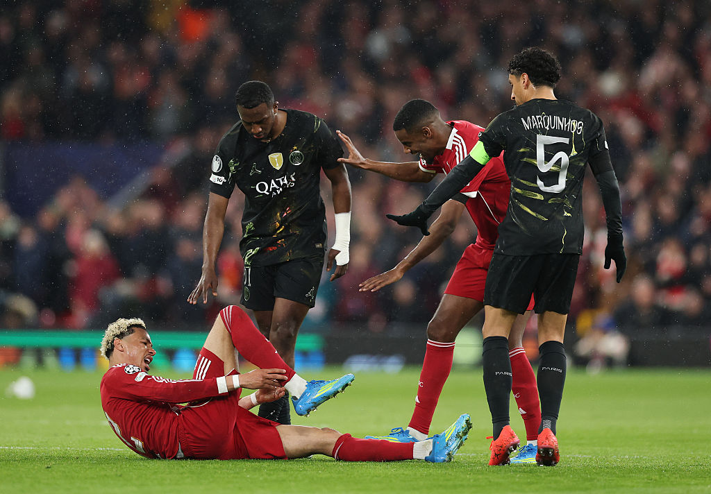 Hugo Ekitike of Liverpool holds his ankle as he appears to be injured during the UEFA Champions League 2025/26 Quarter-Final Second Leg match between Liverpool FC and Paris Saint-Germain FC at Anfield