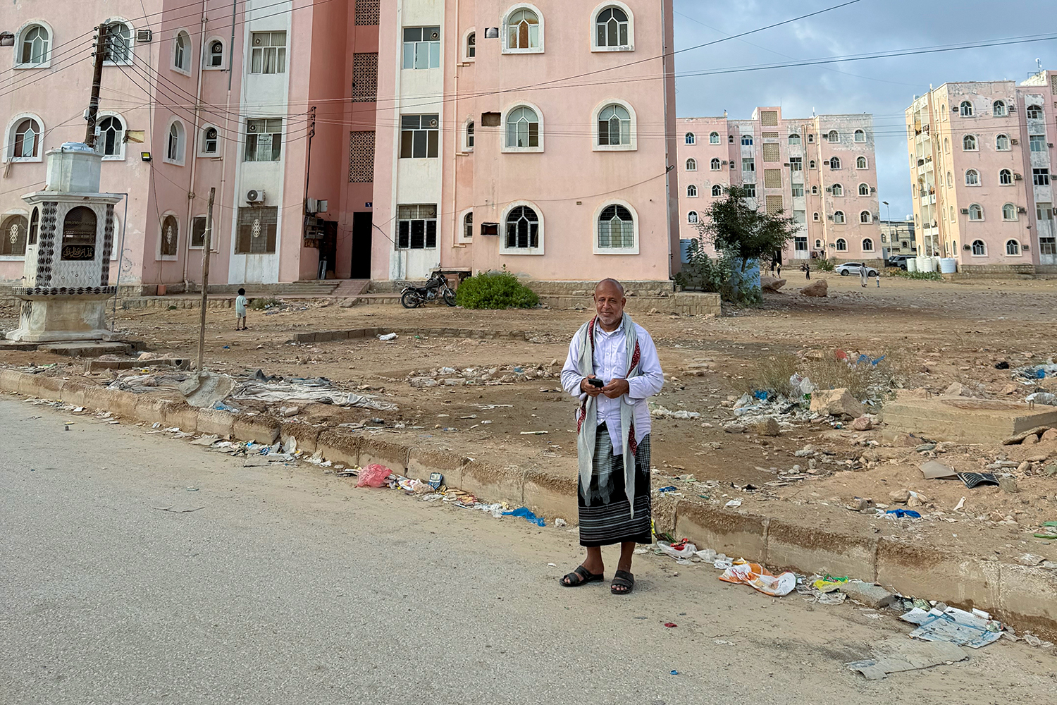 Mohammed Salem, a teacher with 31 years of experience in Mukalla, says he has taken on three jobs to make ends meet after his salary lost much of its value due to the rapid devaluation of the Yemeni riyal. (Saeed al-Batati/Al Jazeera]