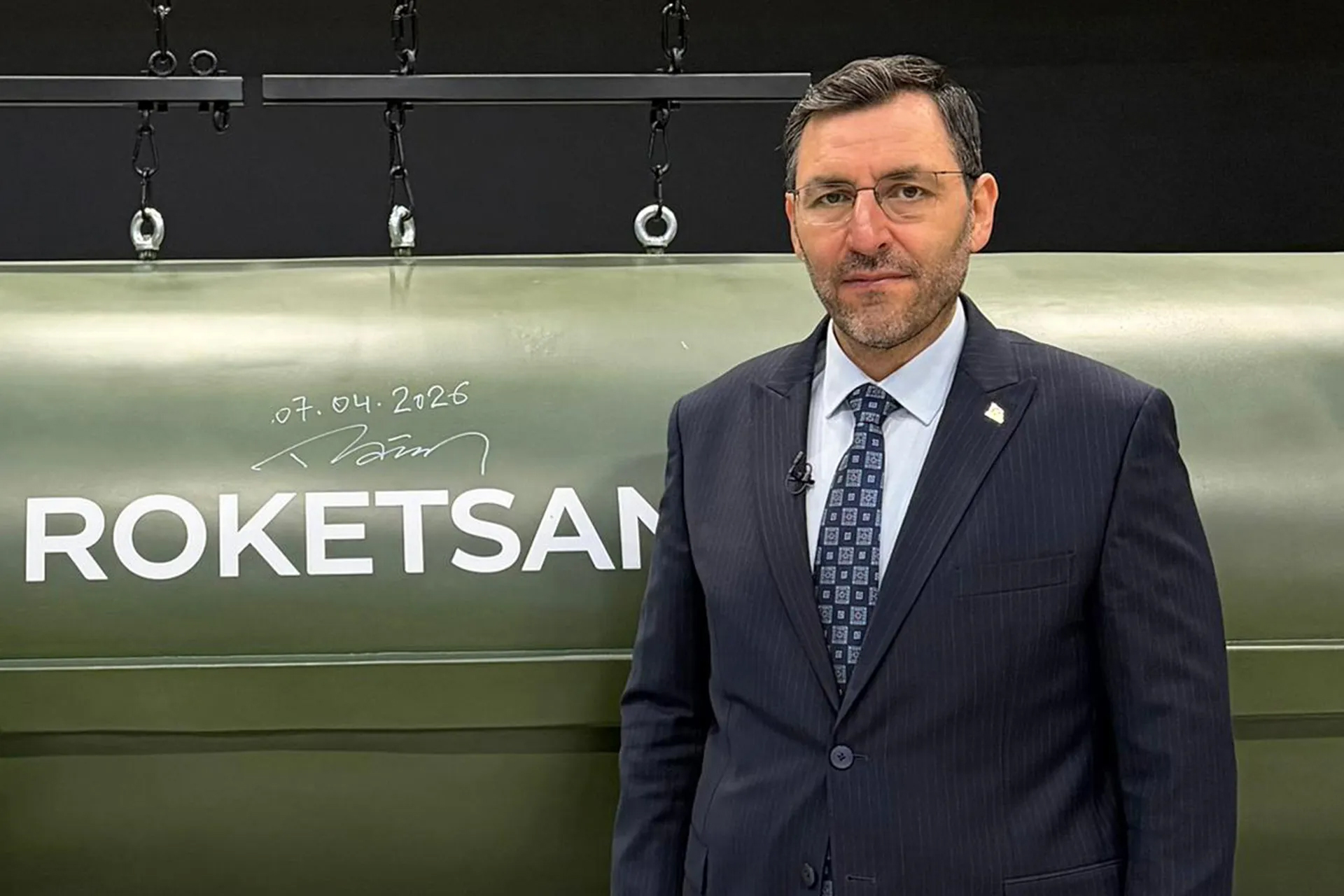 Murat İkinci, General Manager of Roketsan, stands next to a Tayfun ballistic missile at the company's facility in Ankara. [Al Jazeera]