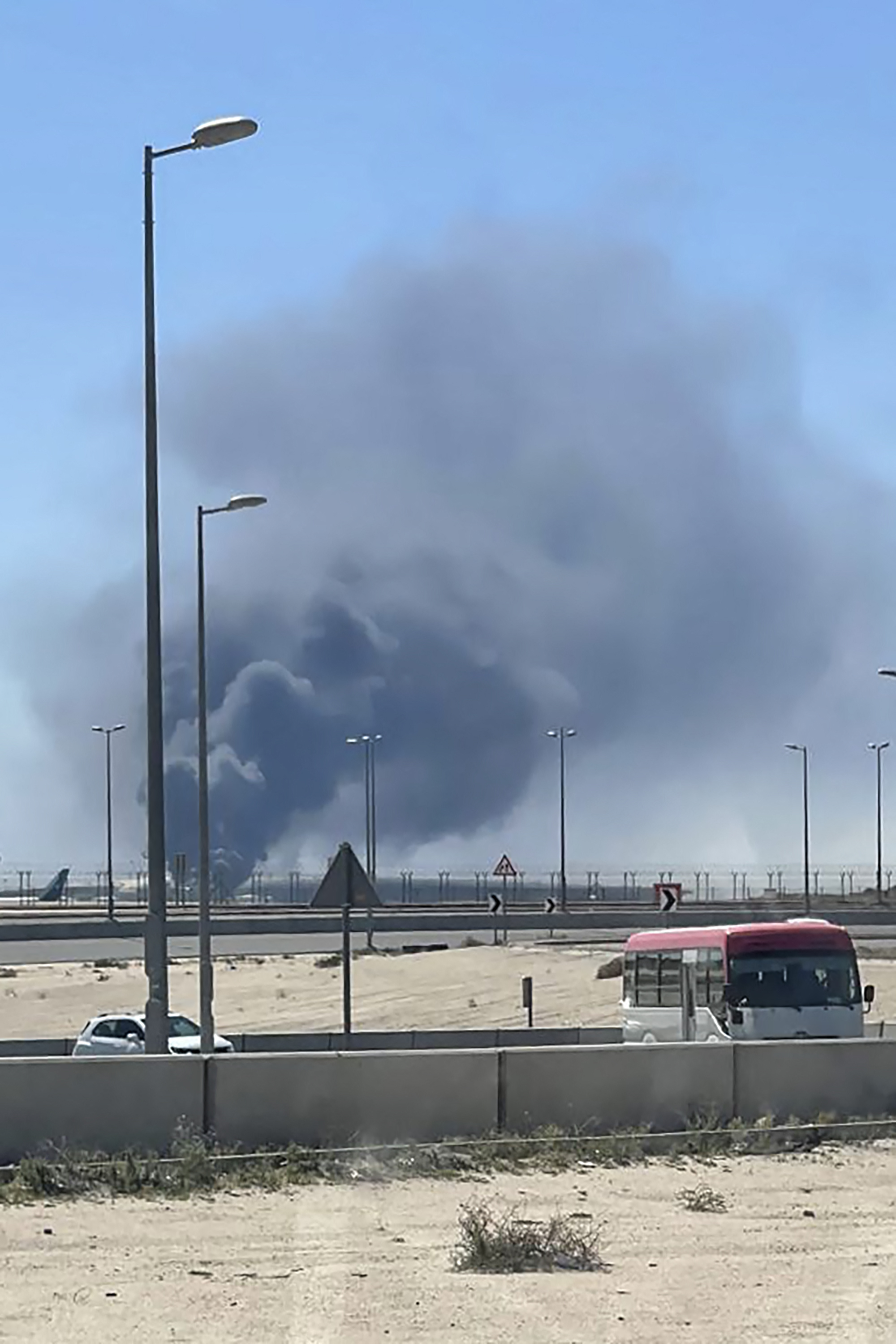 Smoke rises from an area of Kuwait's international airport after a reported drone attack