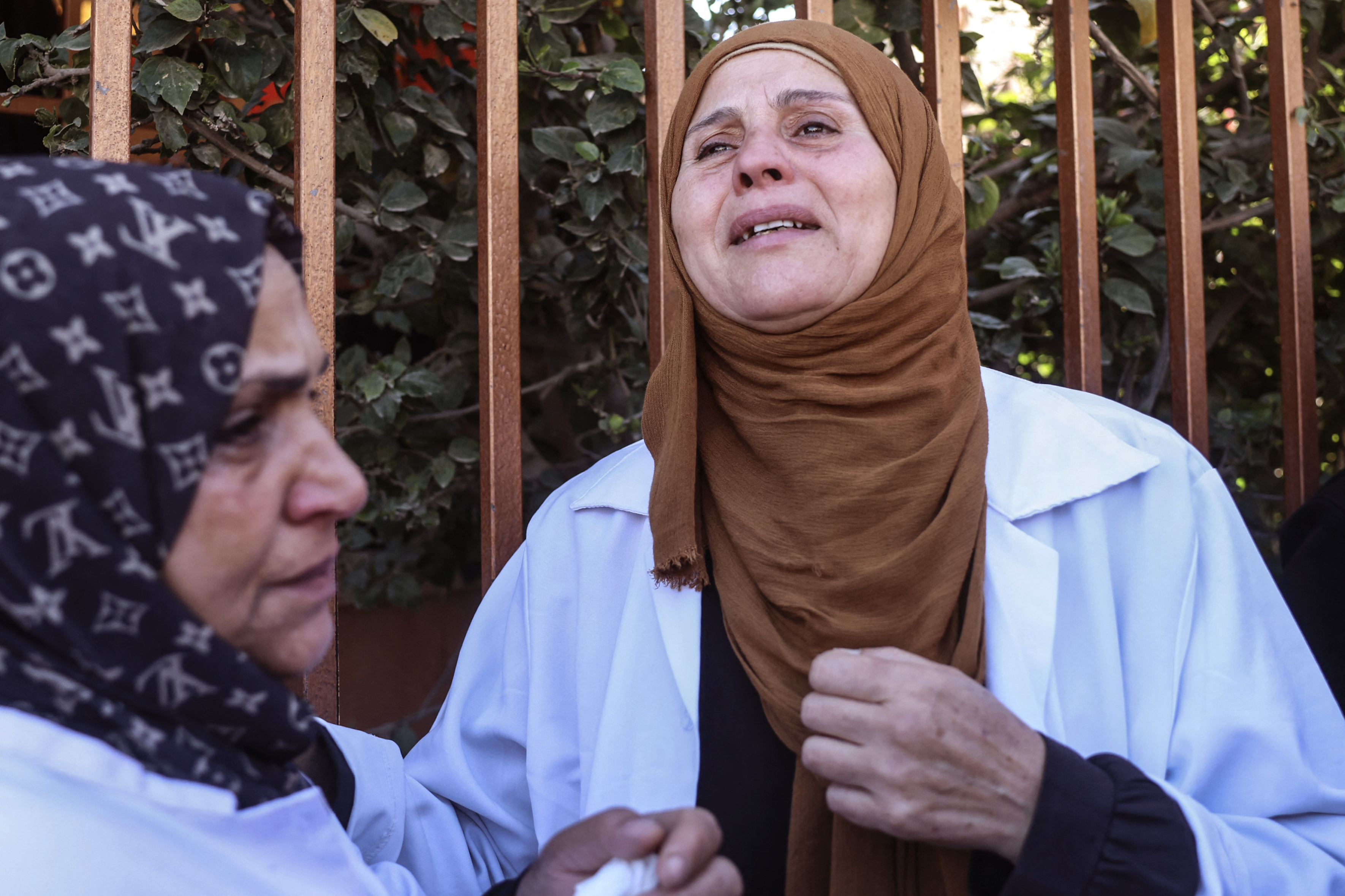 A Palestinian carers reacts outside the Nasser Hospital after a relative, killed in an Israeli airstrike, was brought to the morgue in the city of Khan Yunis, in the southern Gaza Strip on April 21, 2026.