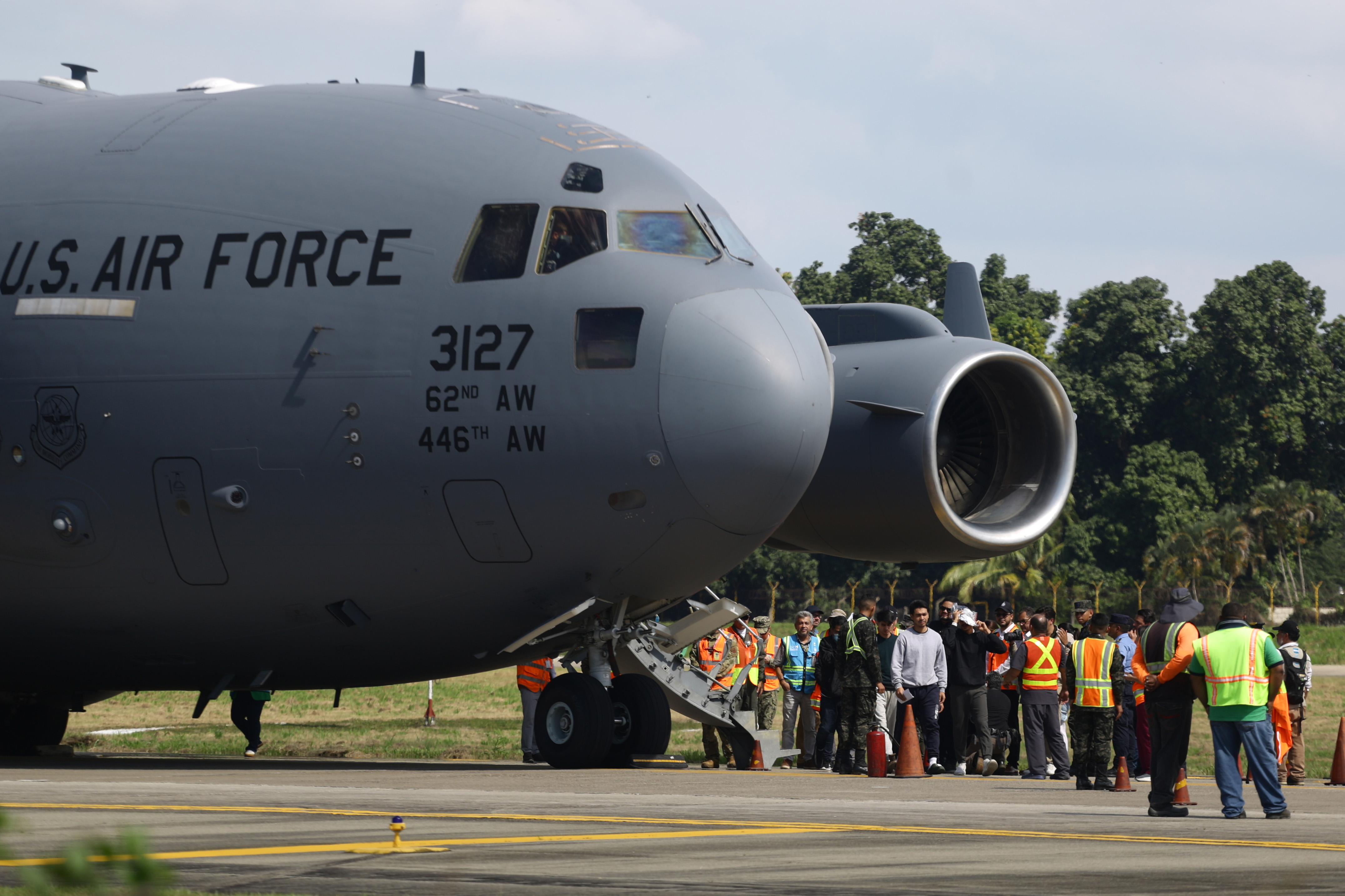 SAN PEDRO SULA, HONDURAS - JANUARY 31: US Air force flight carrying deported migrants by the US government arrive at Ramon Villeda Morales International Airport on January 31, 2025 in San Pedro Sula, Honduras. Honduras receives 126 migrants in two different flights as part of mass deportation plans by the Trump's administration. People were captured once they got into the US or during the raids conducted by the authorities. (Photo by Jorge Salvador Cabrera/Getty Images)