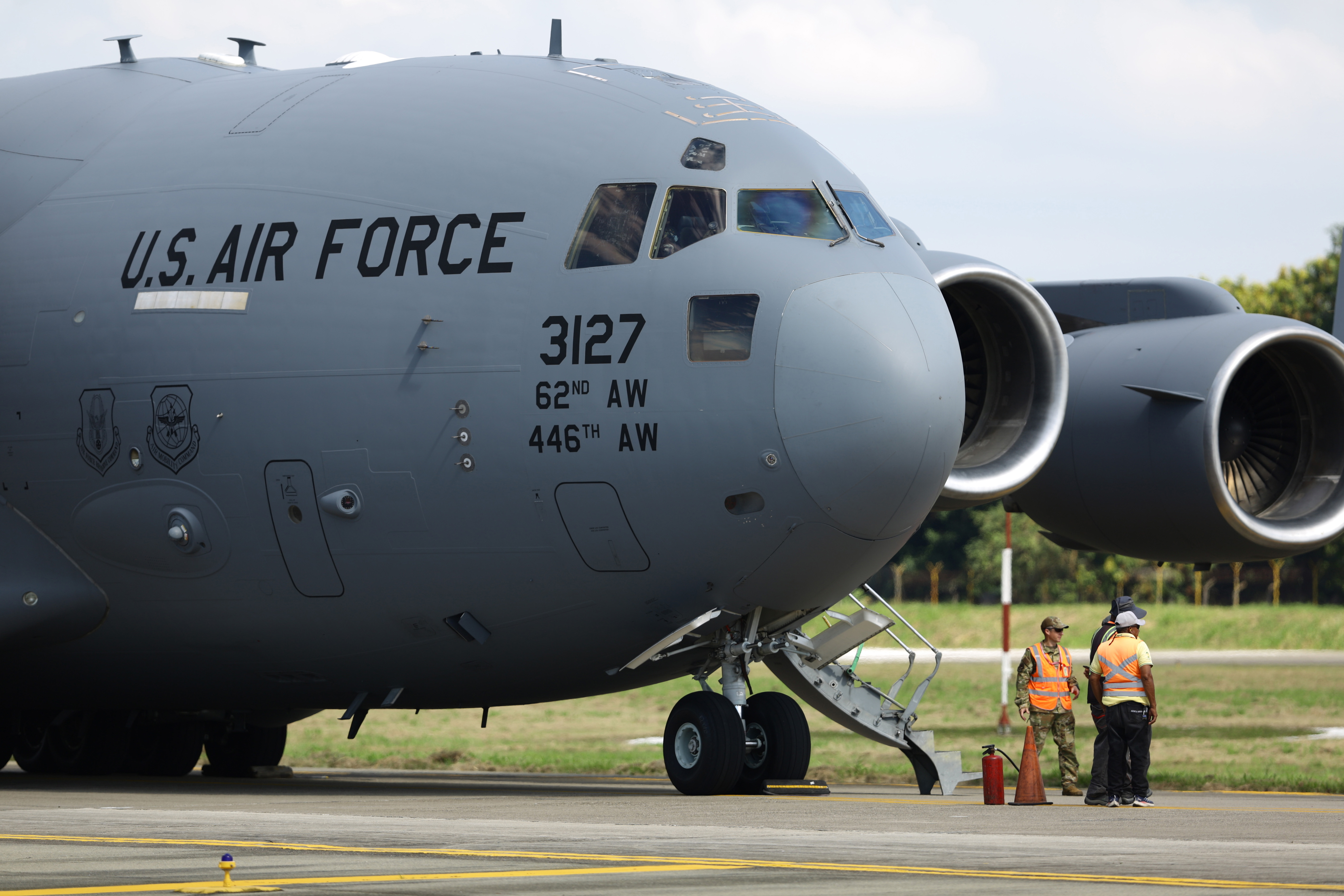 SAN PEDRO SULA, HONDURAS - JANUARY 31: US Air force flight carrying deported migrants by the US government arrive at Ramon Villeda Morales International Airport on January 31, 2025 in San Pedro Sula, Honduras. Honduras receives 126 migrants in two different flights as part of mass deportation plans by the Trump's administration. People were captured once they got into the US or during the raids conducted by the authorities. (Photo by Jorge Salvador Cabrera/Getty Images)