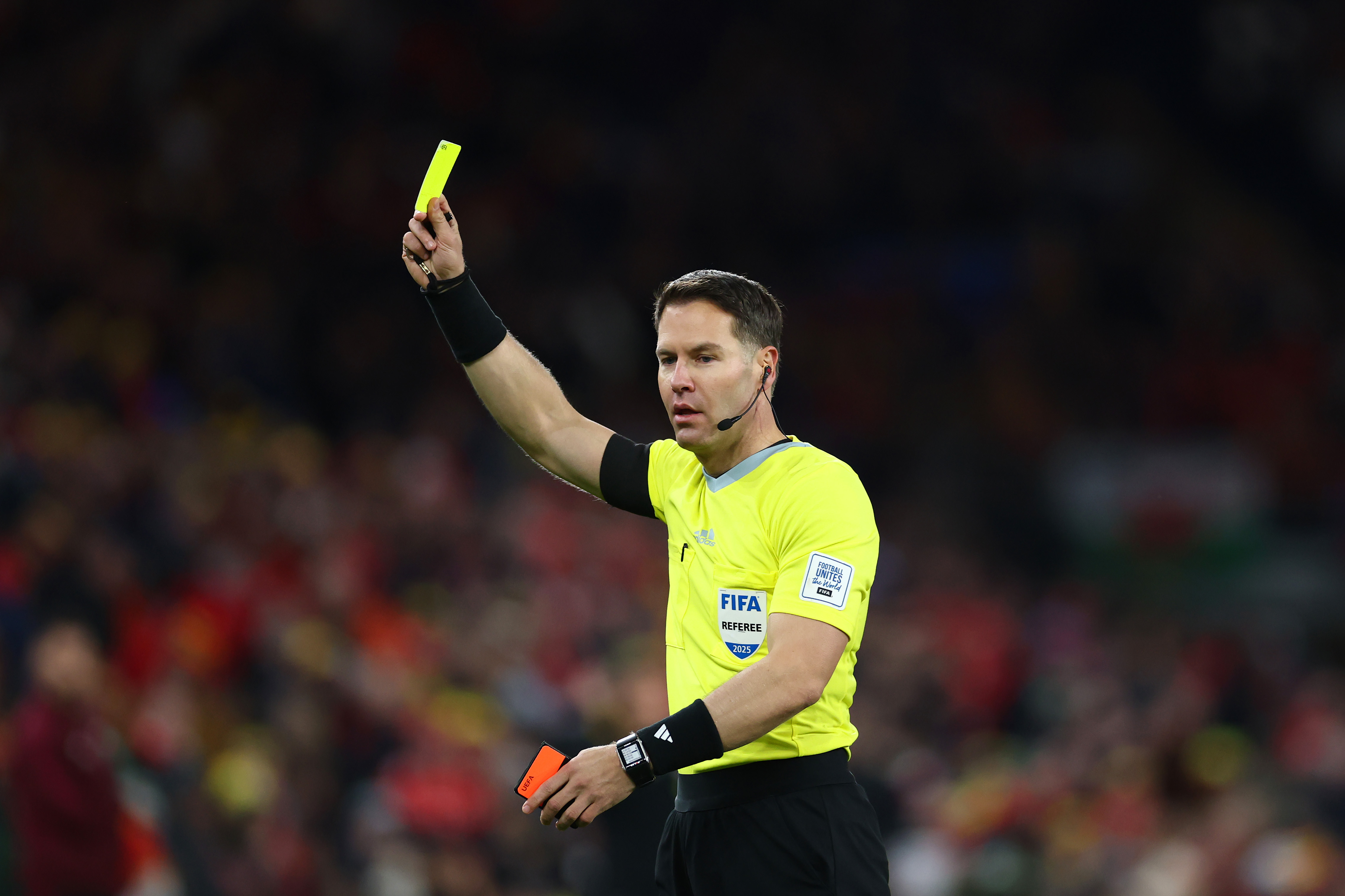 CARDIFF, WALES - NOVEMBER 18: Referee Danny Makkelie shows a yellow card during the FIFA World Cup 2026 qualifier match between Wales and North Macedonia at Cardiff City Stadium on November 18, 2025 in Cardiff, Wales. (Photo by Dan Istitene/Getty Images)