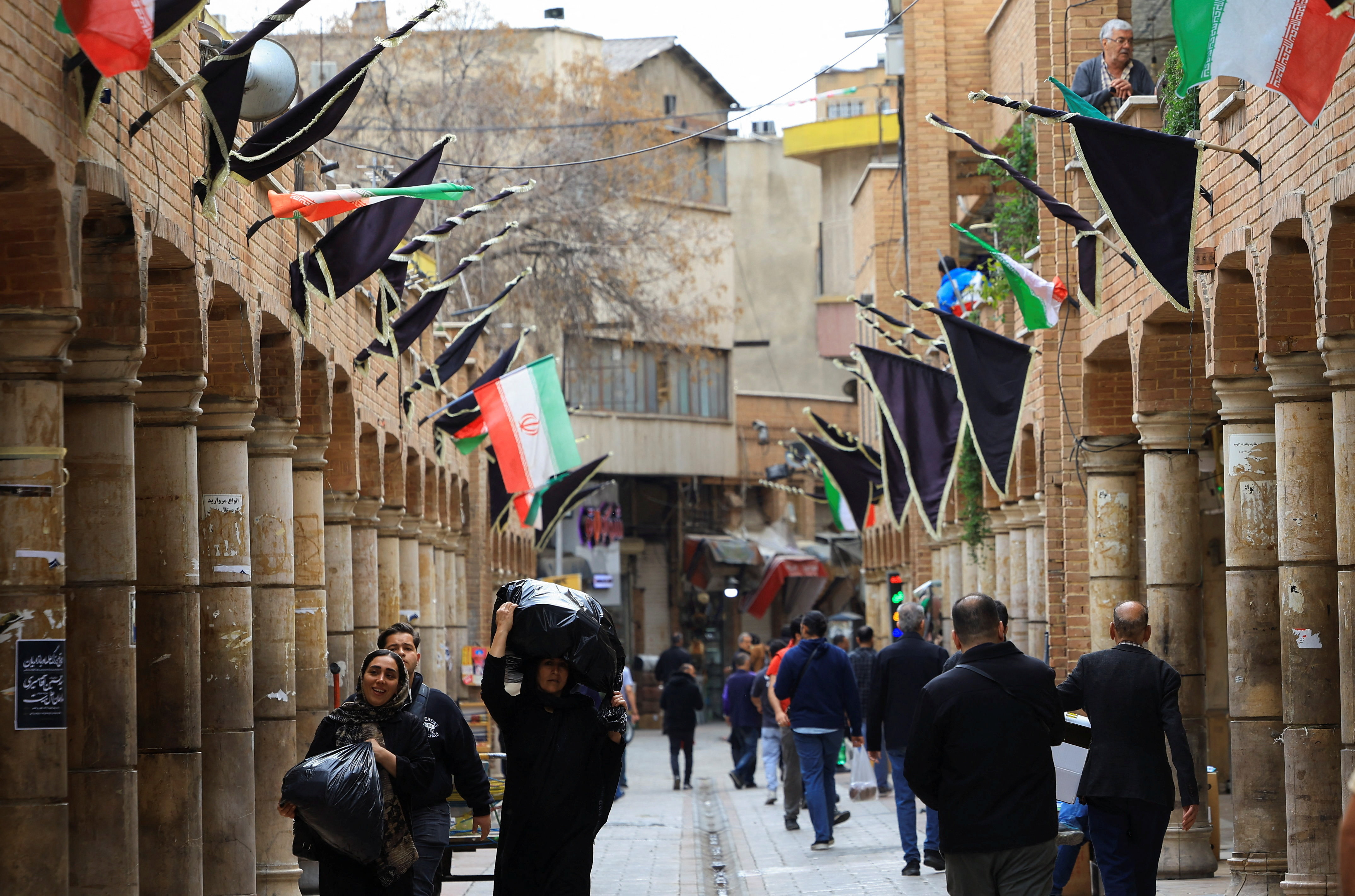 Shoppers walk through Grand Bazaar in Tehran, Iran, April 13, 2026. REUTERS/Thaier Al Sudani
