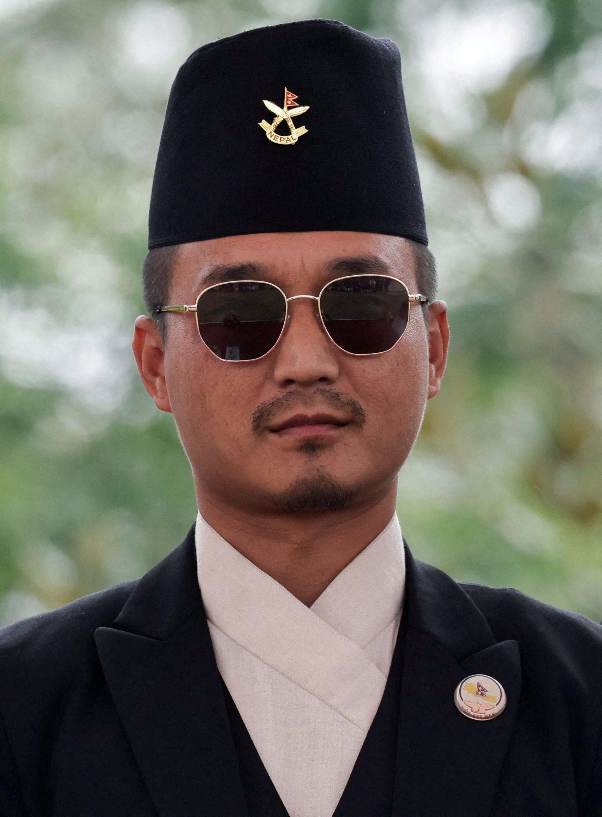 FILE PHOTO: Newly appointed Home Minister Sudan Gurung poses for a picture after taking oath at "Shital Niwas", the presidential building in Kathmandu, Nepal, March 27, 2026. REUTERS/Navesh Chitrakar/File Photo